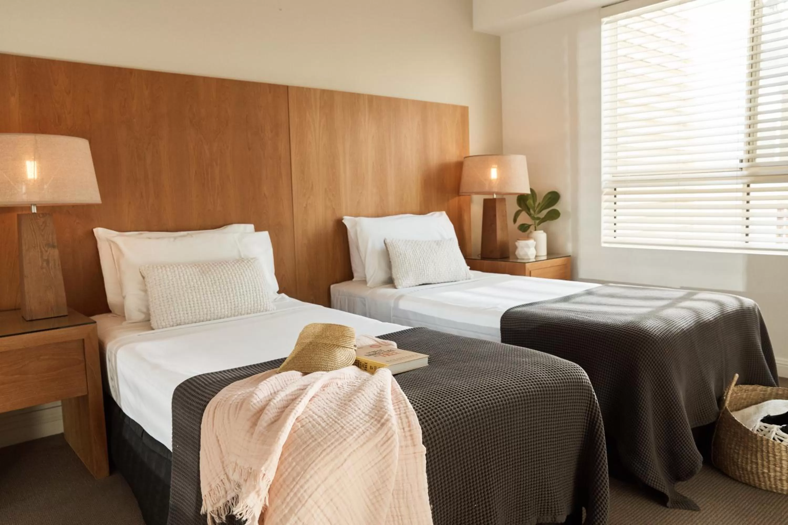 Bed in Sea Change Beachfront Apartments