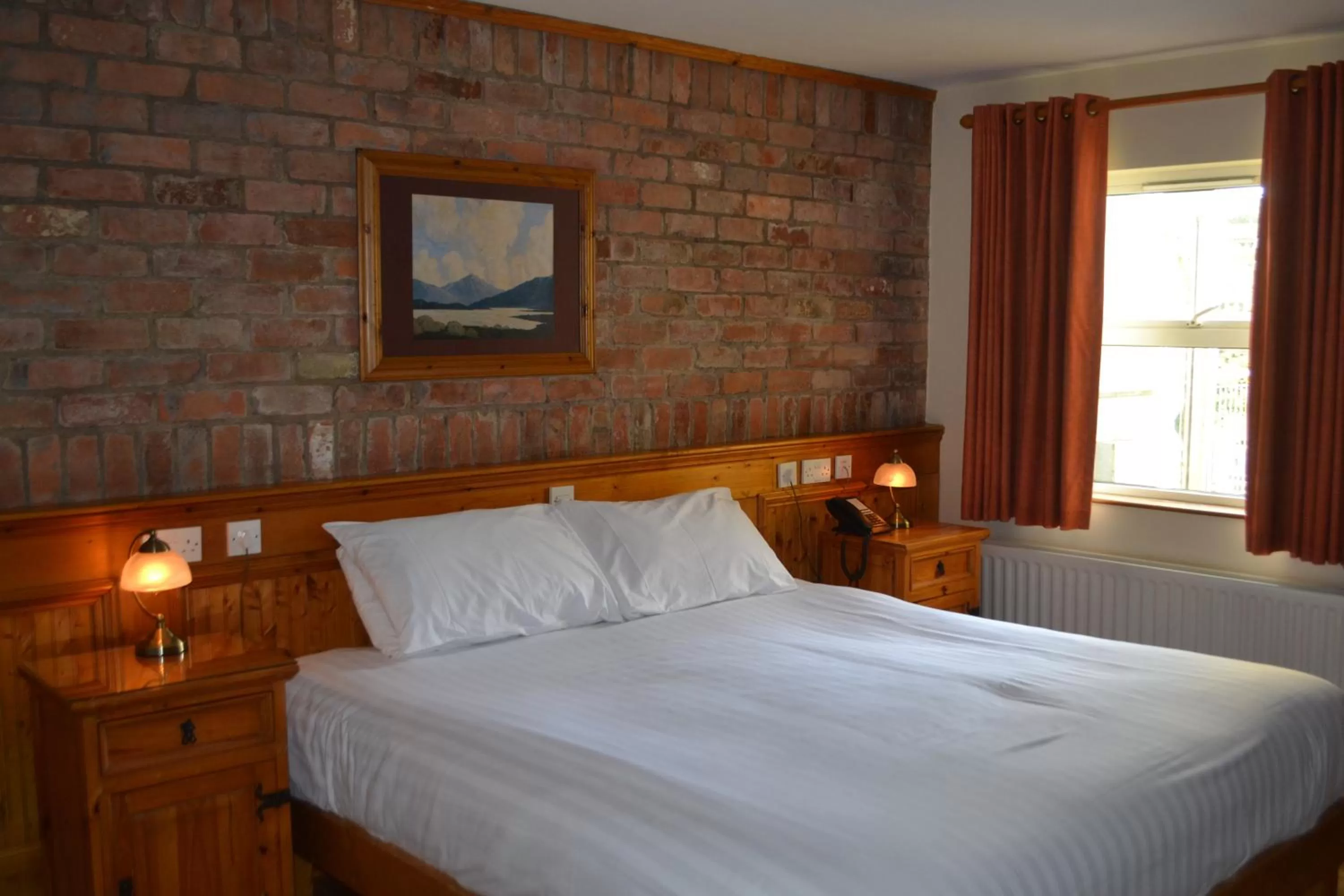 Bed in Walsh's Hotel and Apartments