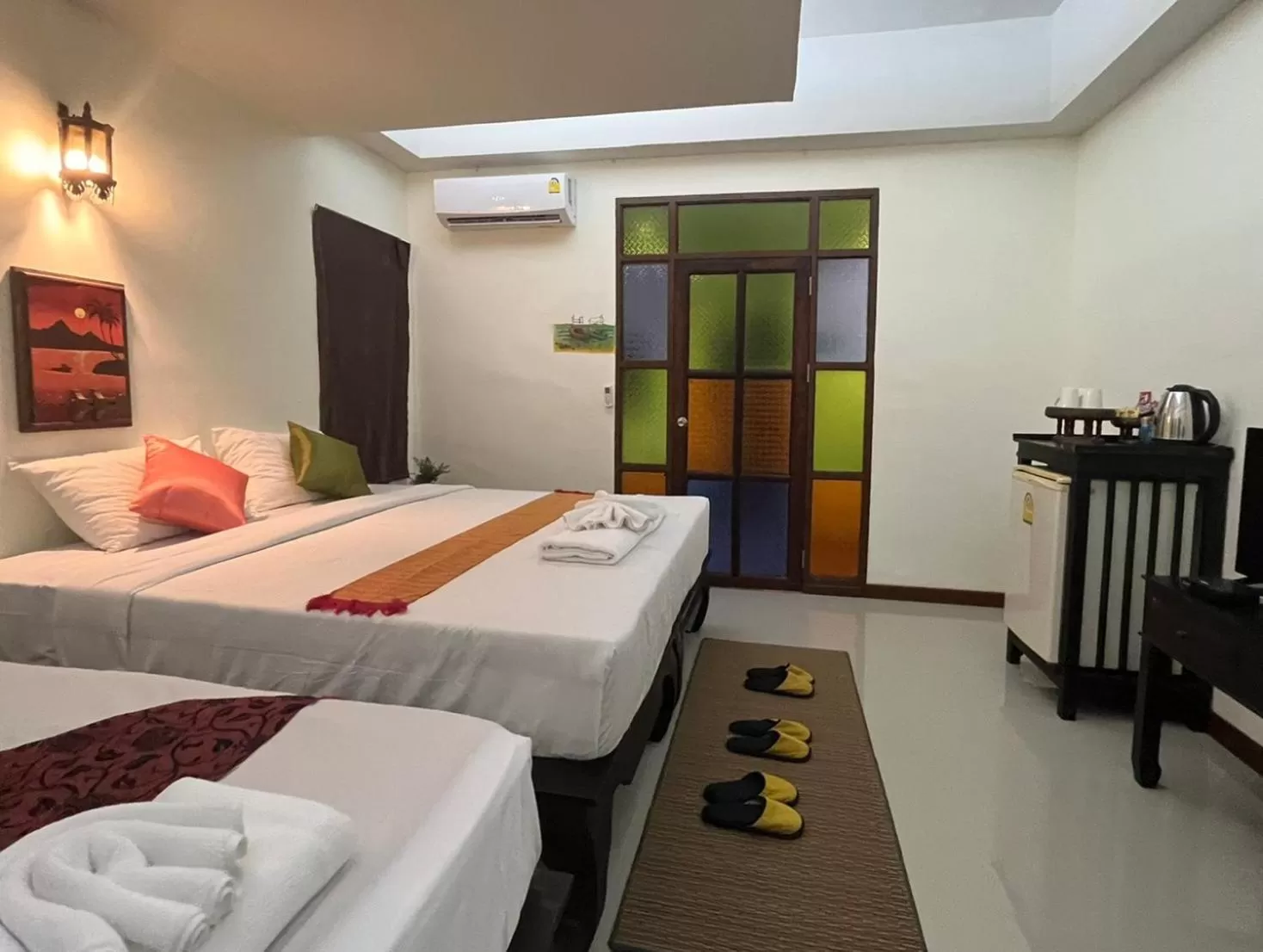 Bed in Rainforest Huahin Village Hotel