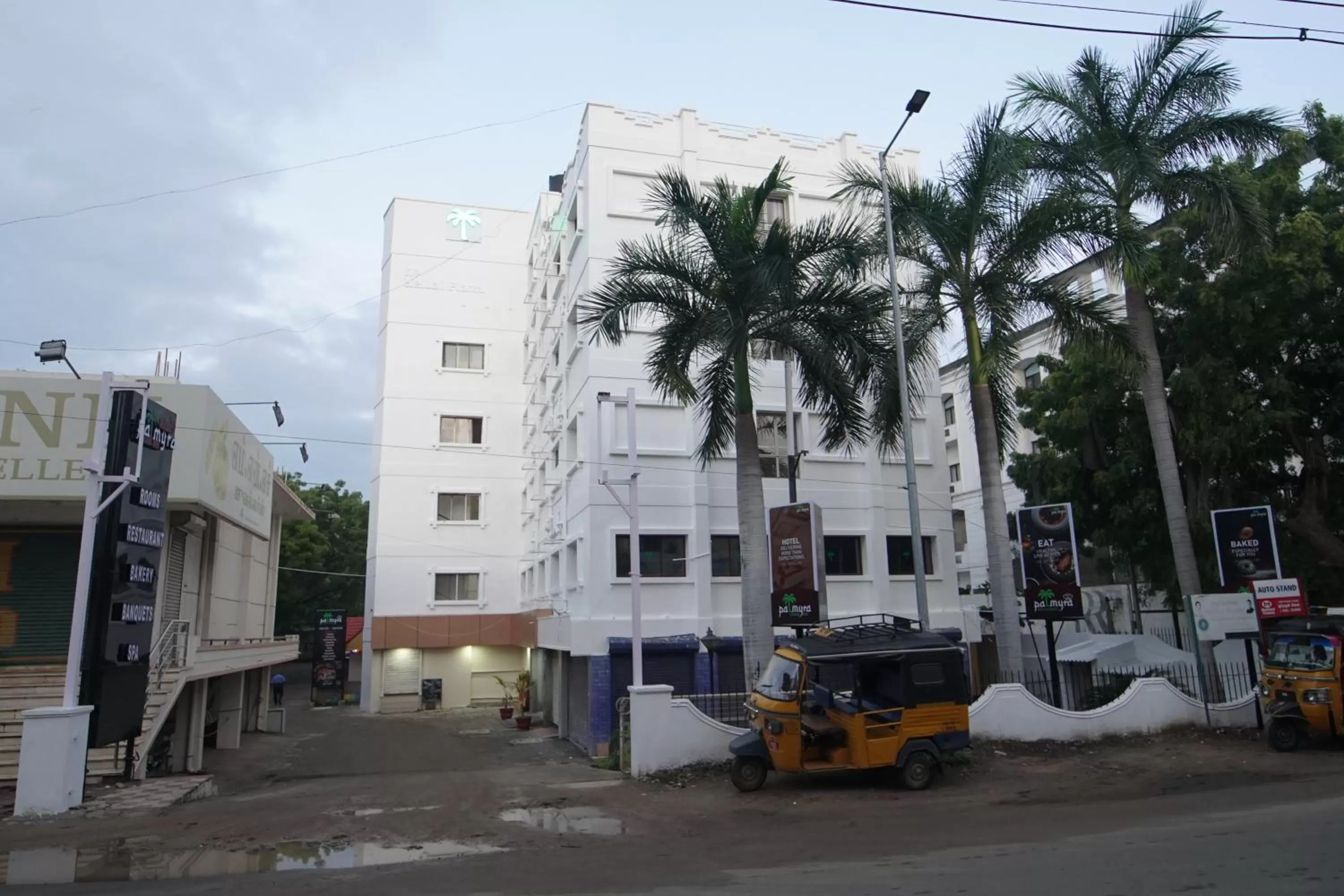 Property building in Hotel Palmyra Grand Inn