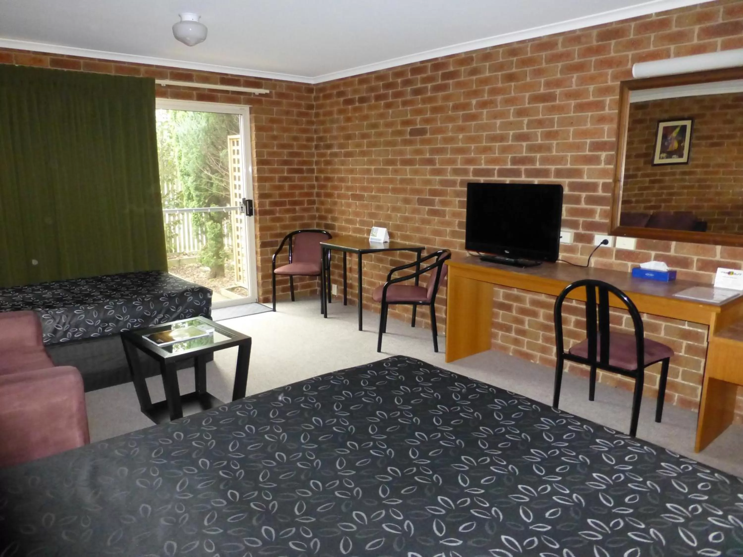 Photo of the whole room, TV/Entertainment Center in Inverloch Central Motor Inn