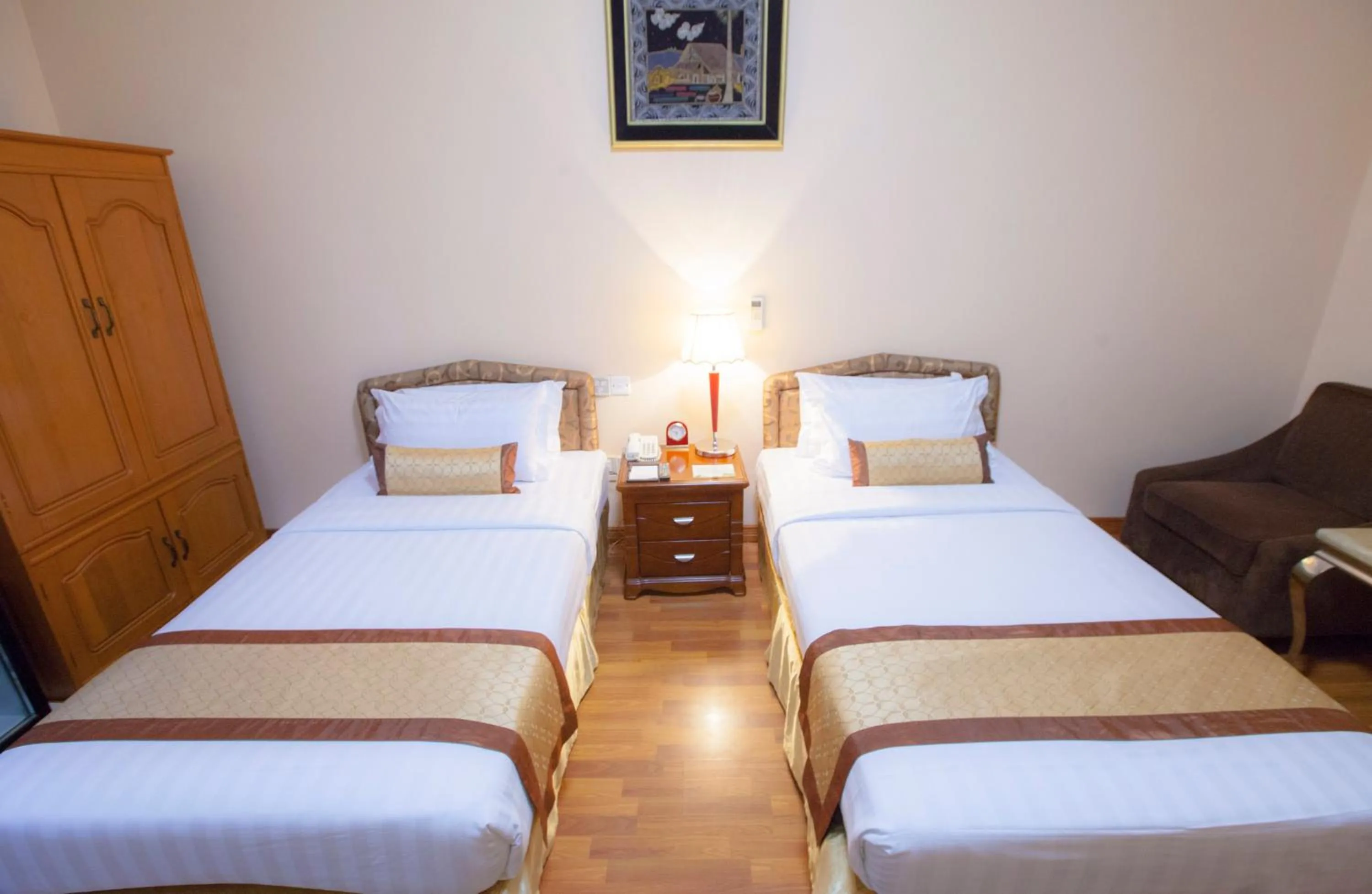 Bed in Grand Palace Hotel