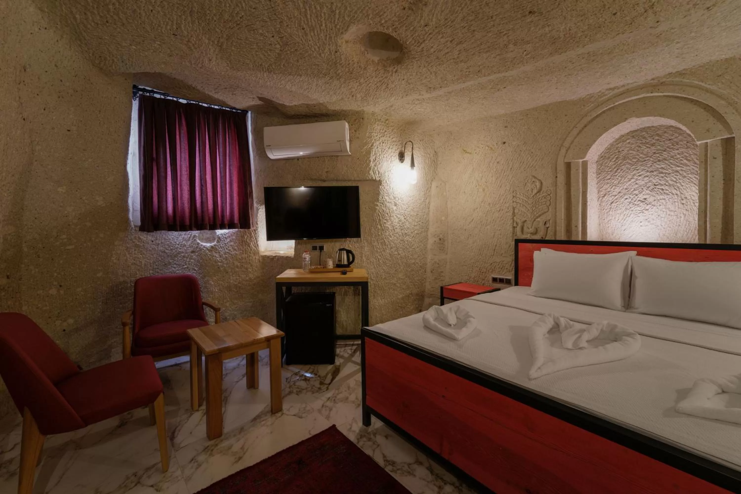 Bed in The Niche Cave Hotel