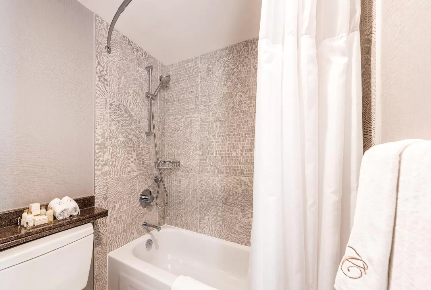 Bathroom in Carmana Hotel & Suites