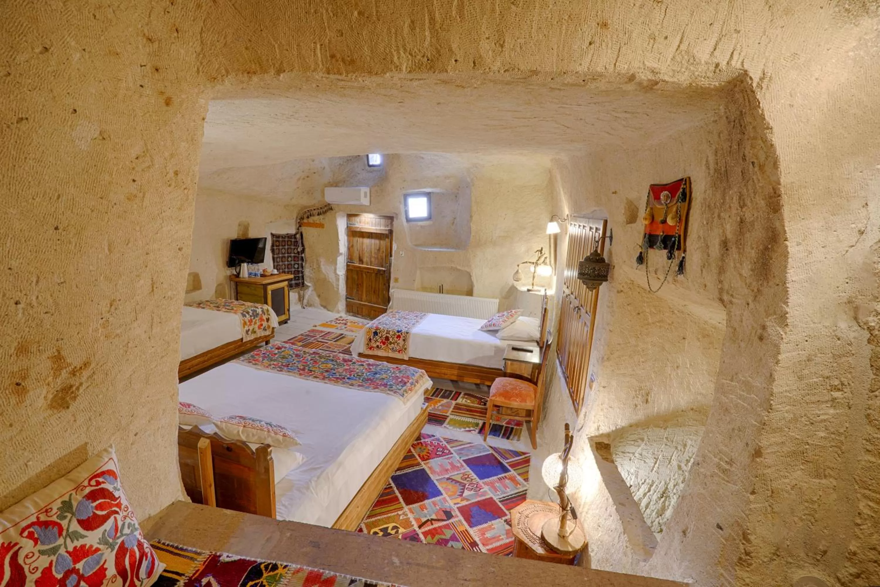 Bed in Tulip Cave Suites