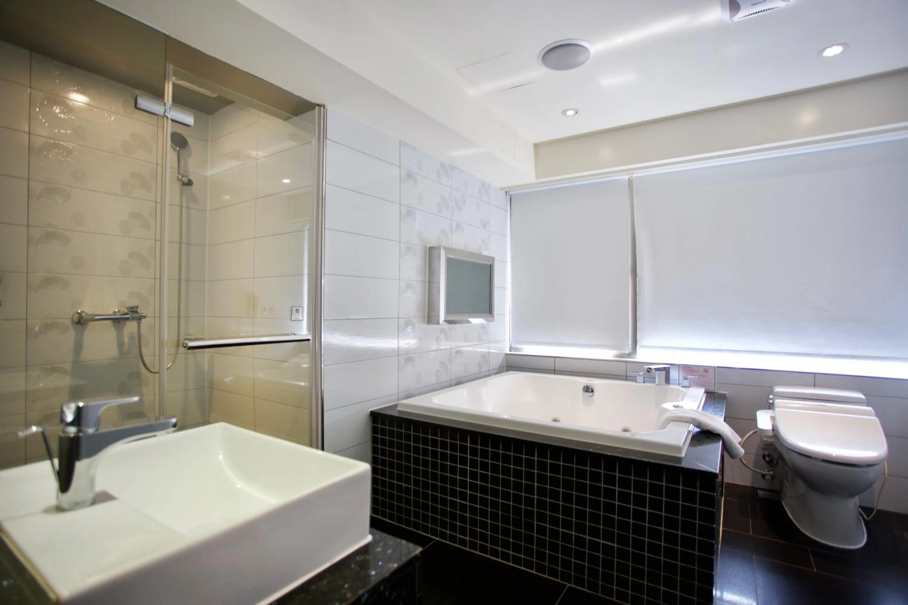 Bathroom in V-one Vogue Hotel