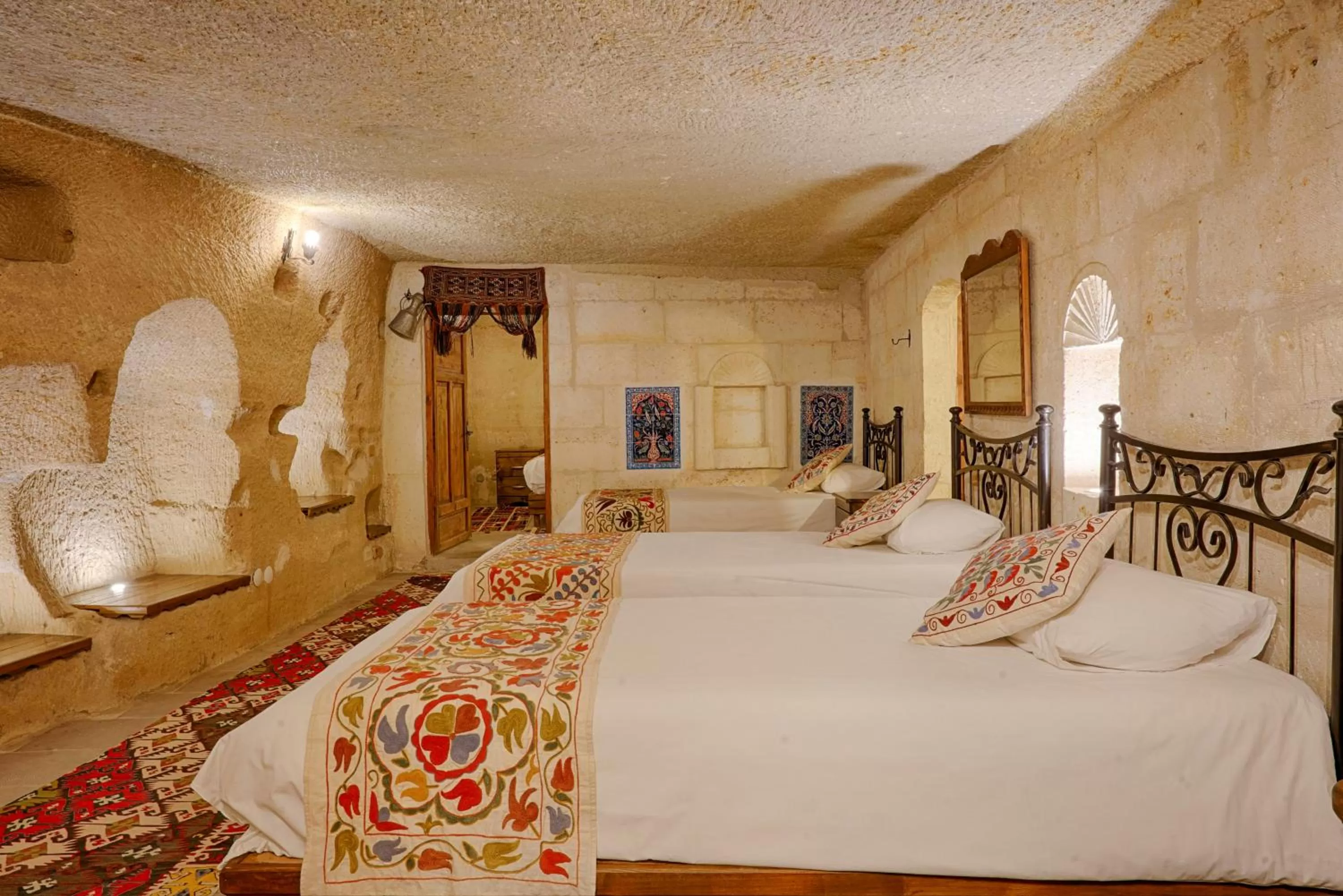 Bed in Tulip Cave Suites