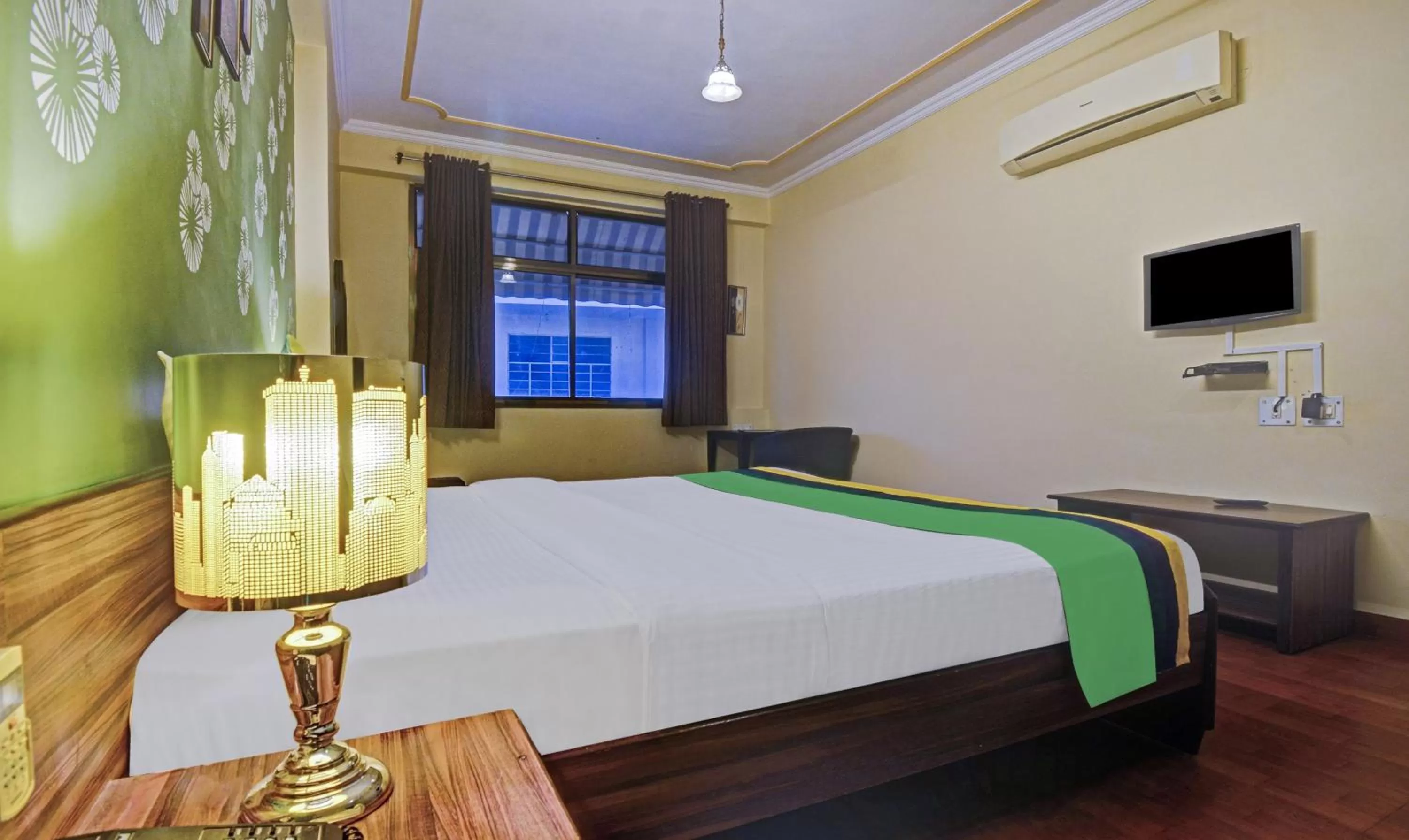 Bedroom, Bed in Treebo New Rockwell Vivek Vihar