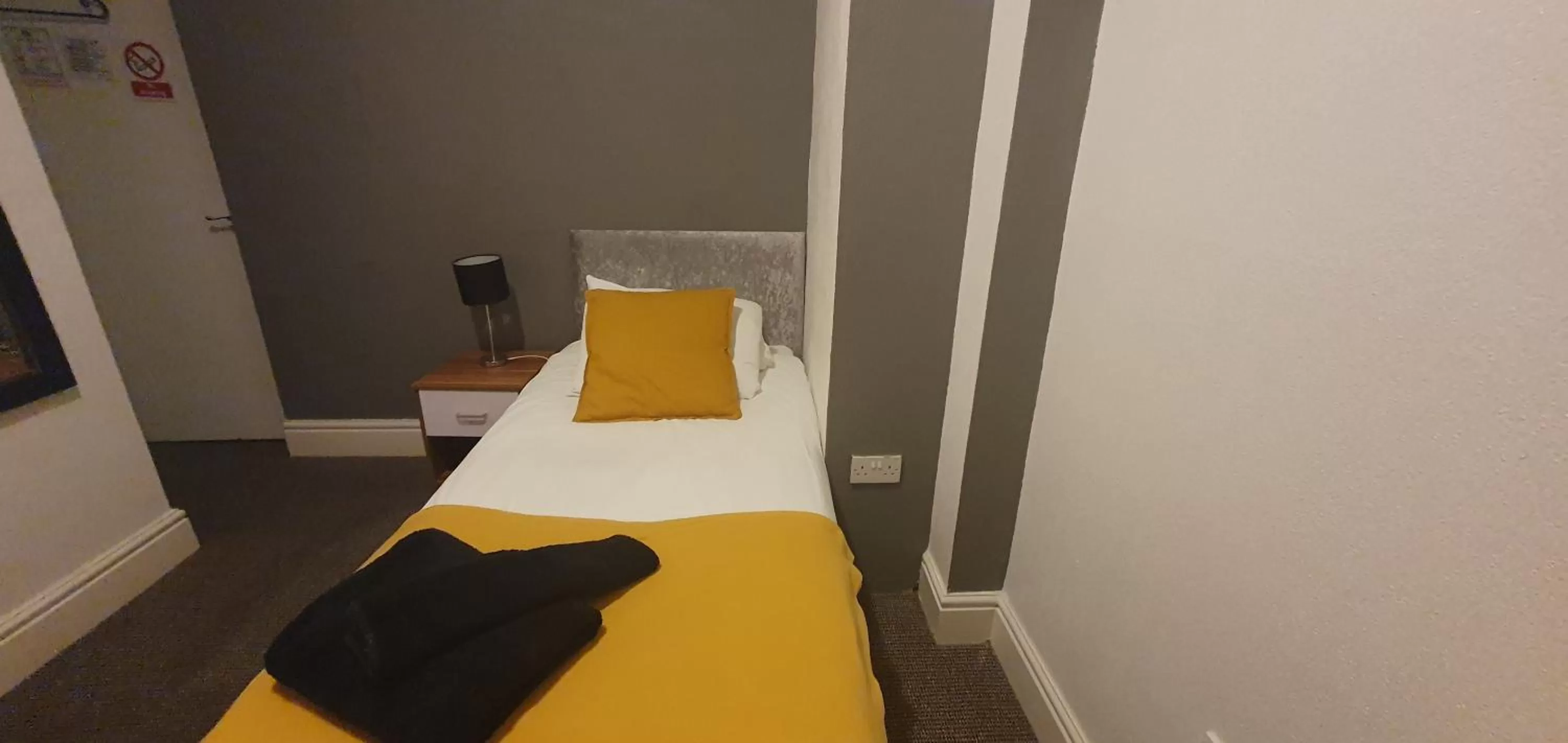 Bed in Palm Beach Hotel by the Sea