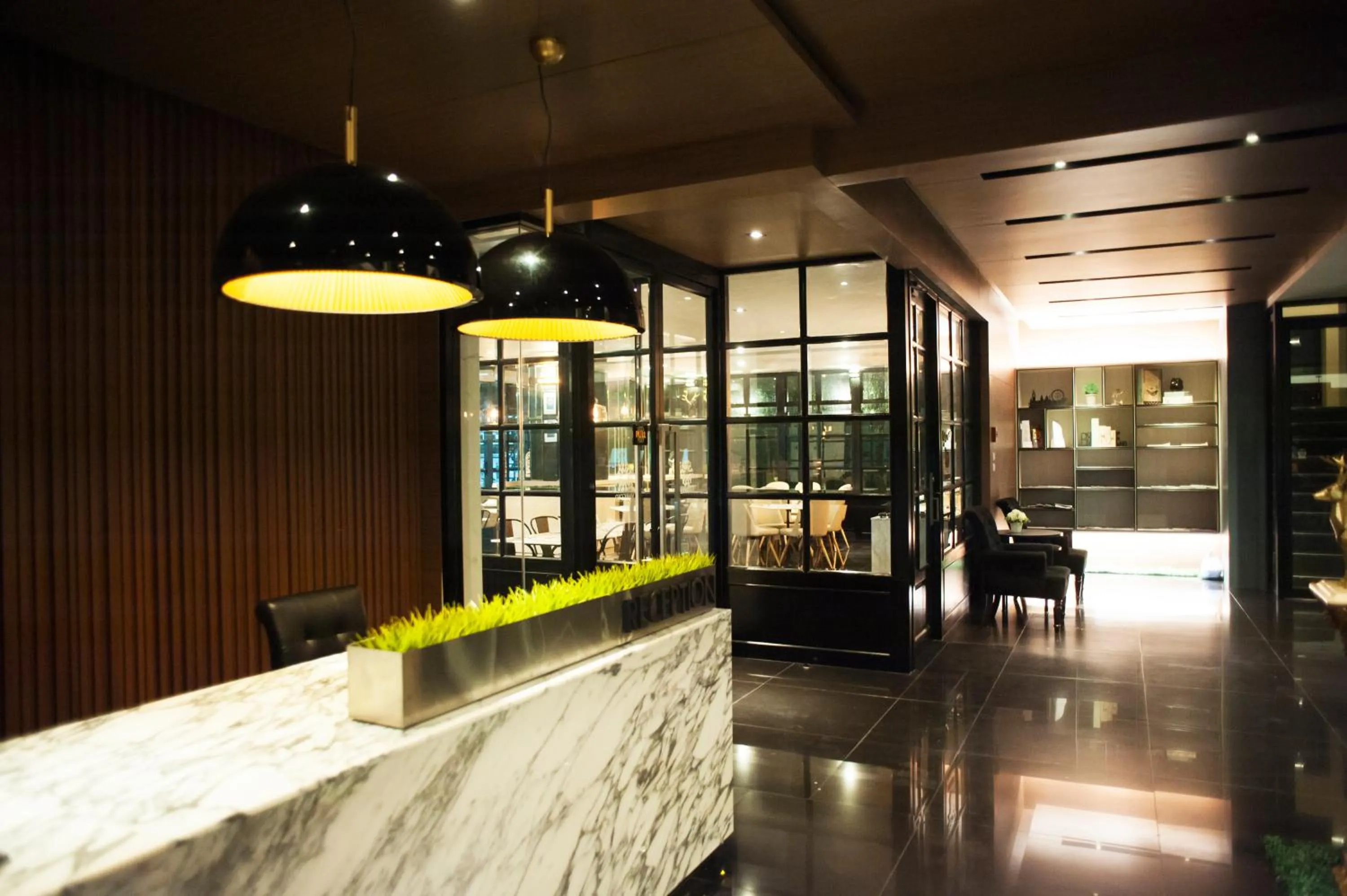 Lobby or reception in Marigold Sukhumvit - Free Shuttle to BTS Bearing Station