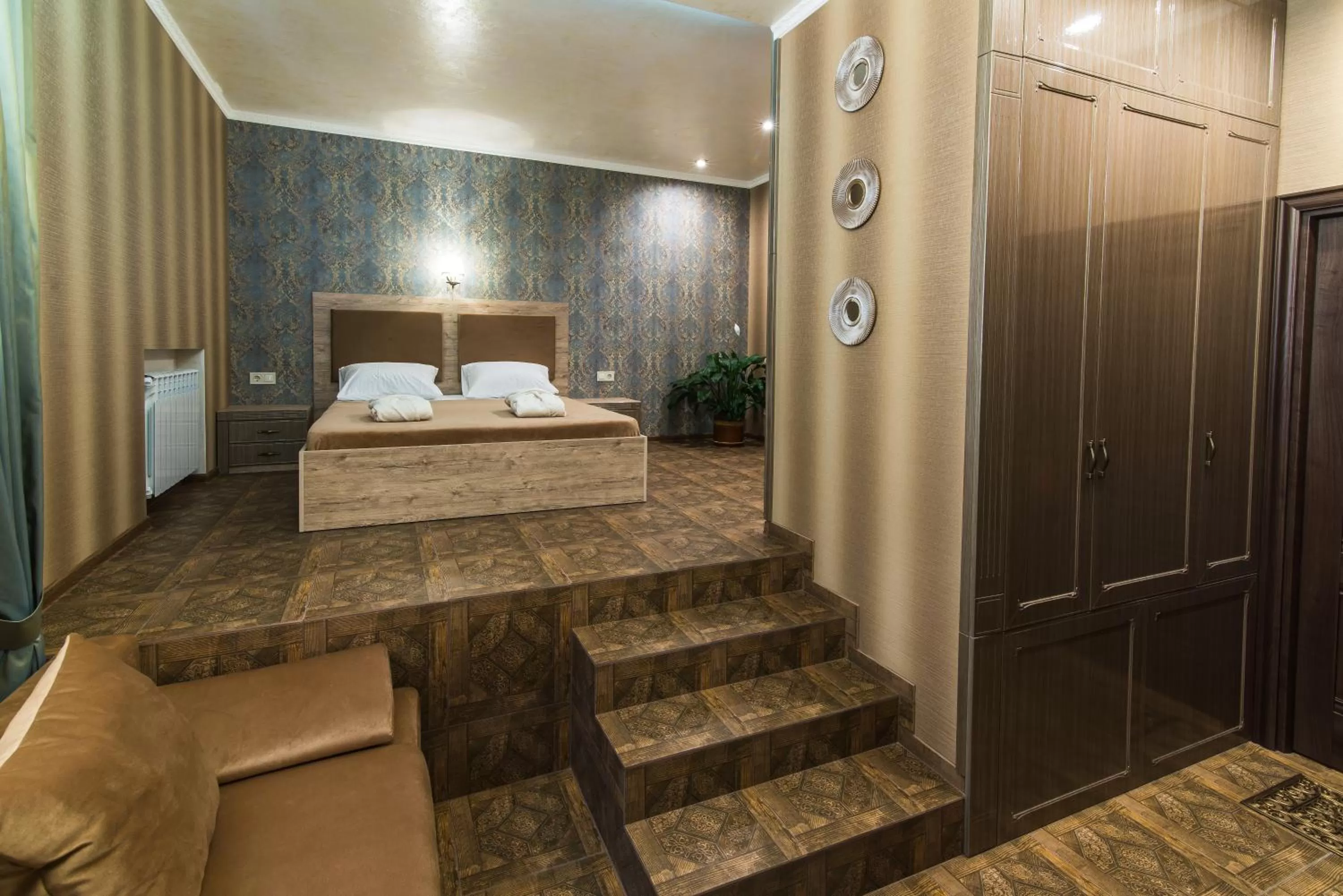 Bed in L.O.Y Family Hotel