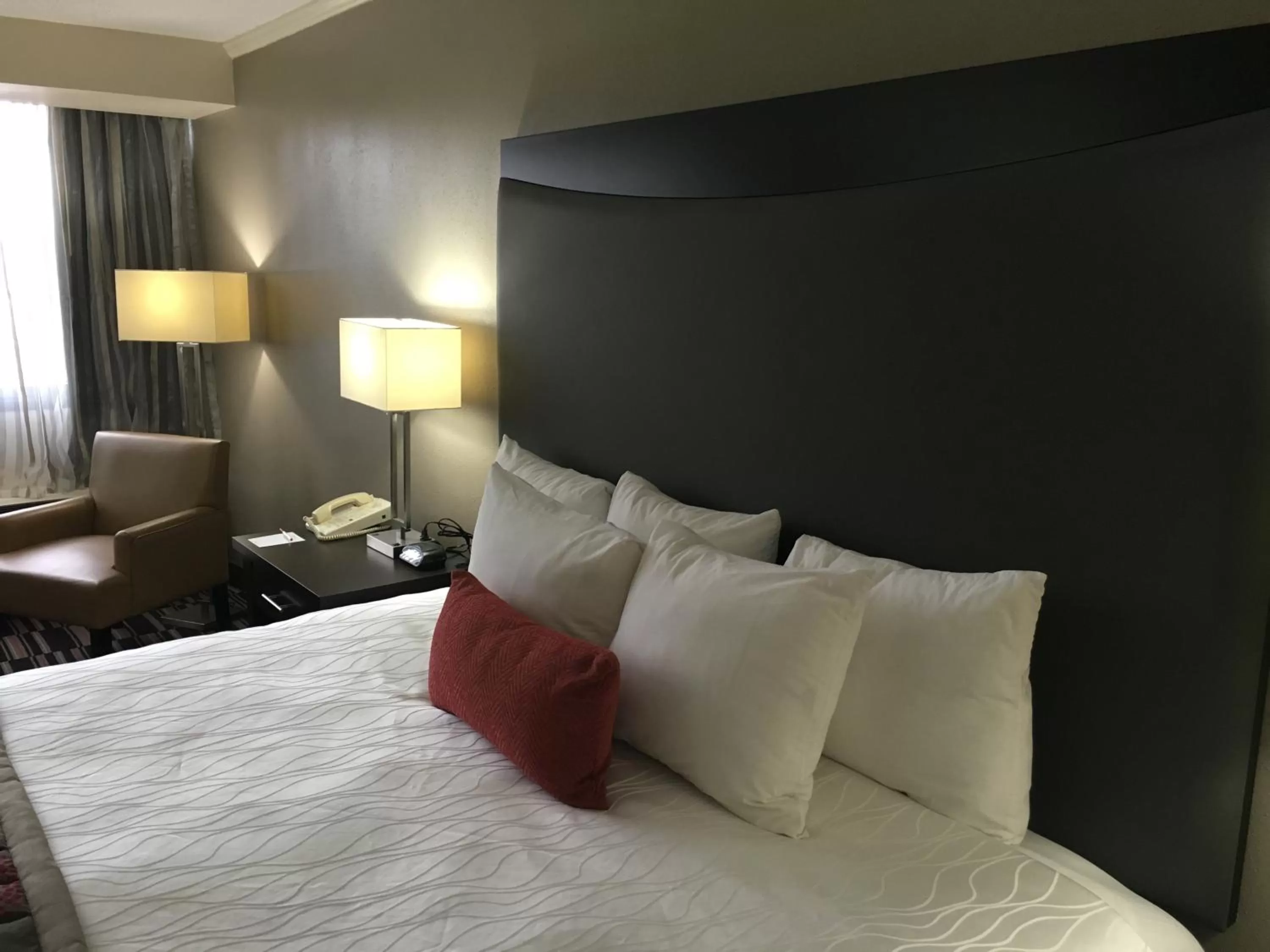 Bed in Ramada Plaza by Wyndham Charlotte South End Airport