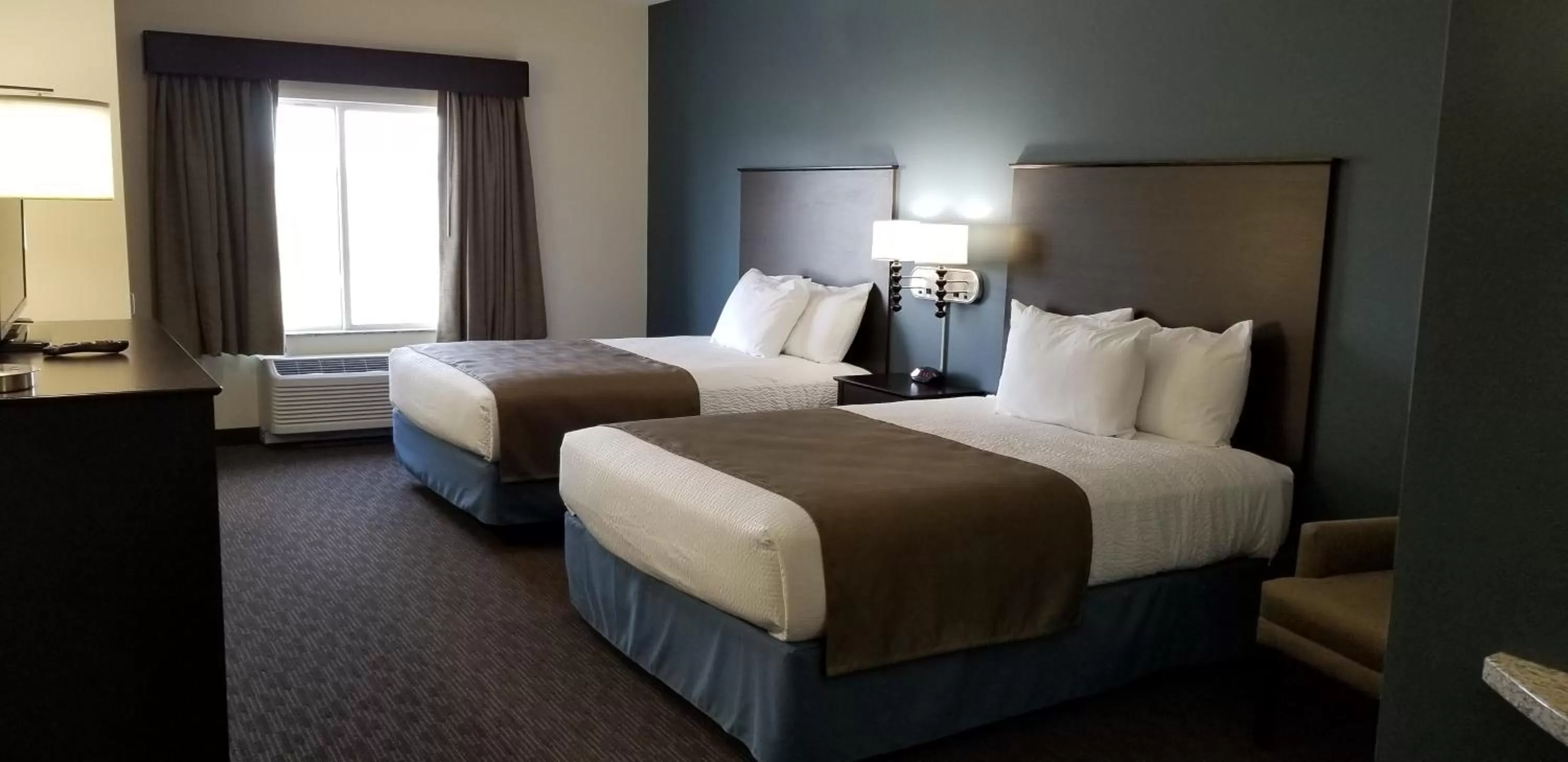 Bed in AmericInn by Wyndham Sioux Falls North