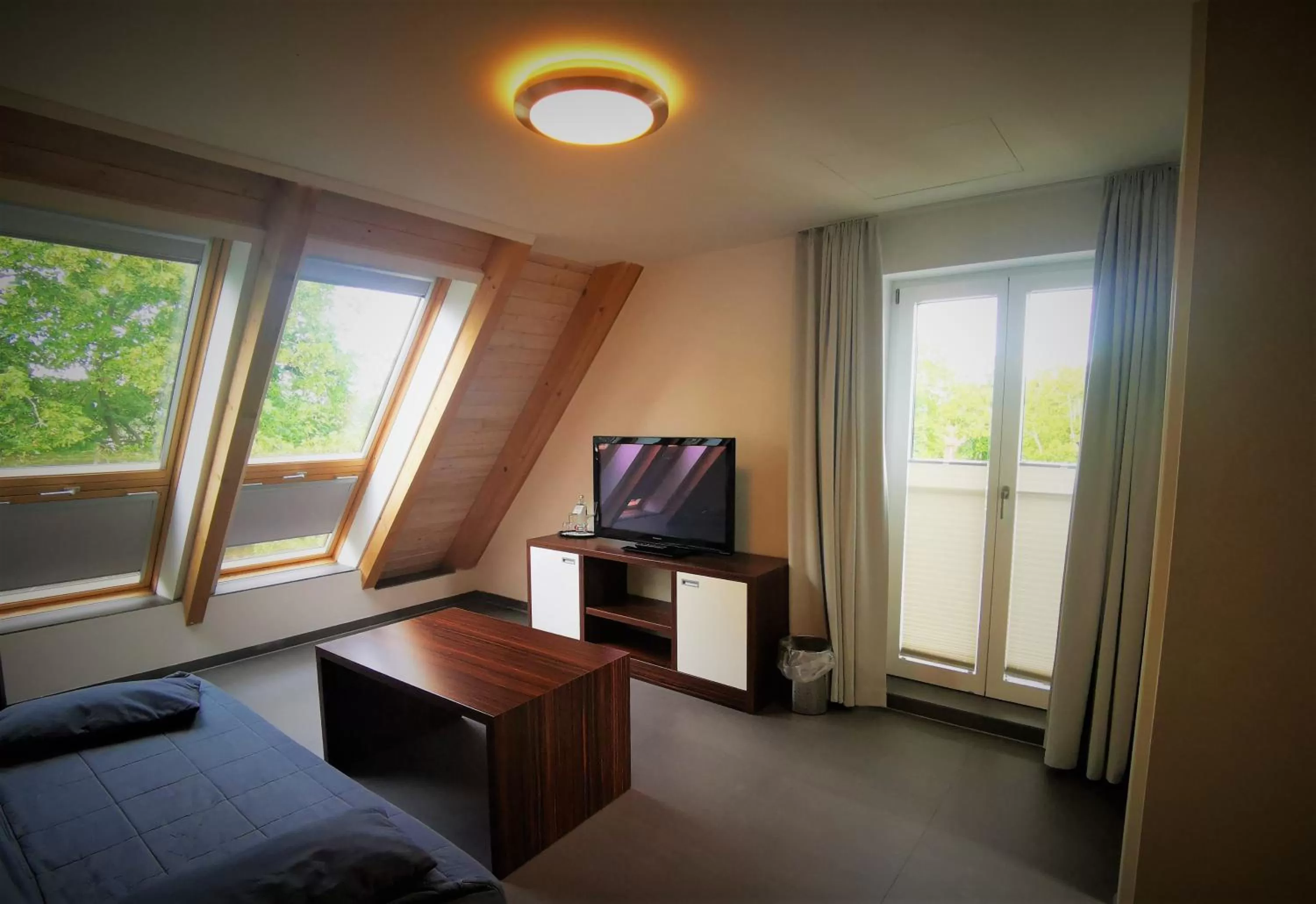 Living room, TV/Entertainment Center in Strandhotel Dranske