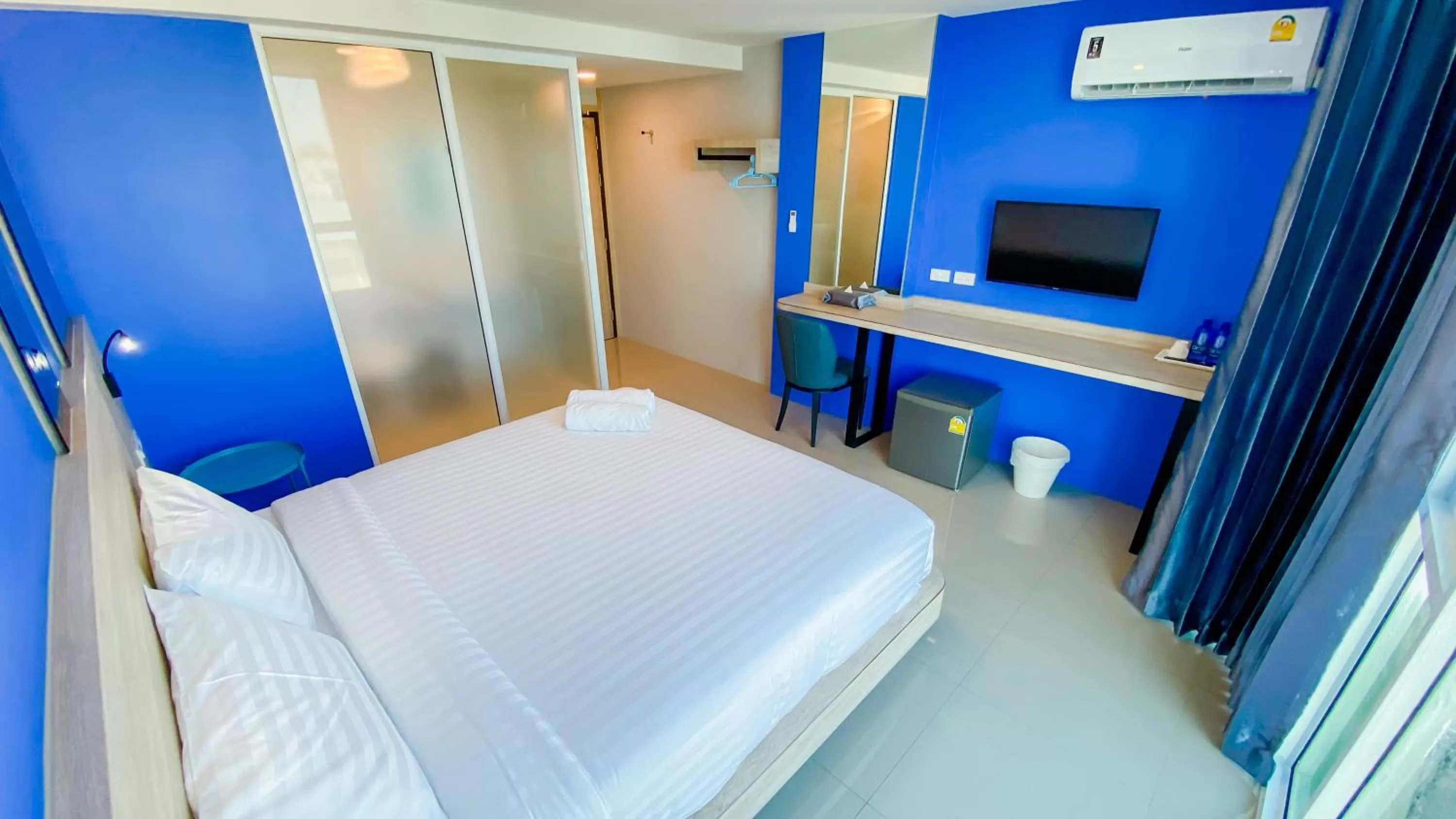 Photo of the whole room, Bed in วัน บัดเจท เชียงราย สนามกีฬา One Budget Hotel Chiangrai Stadium