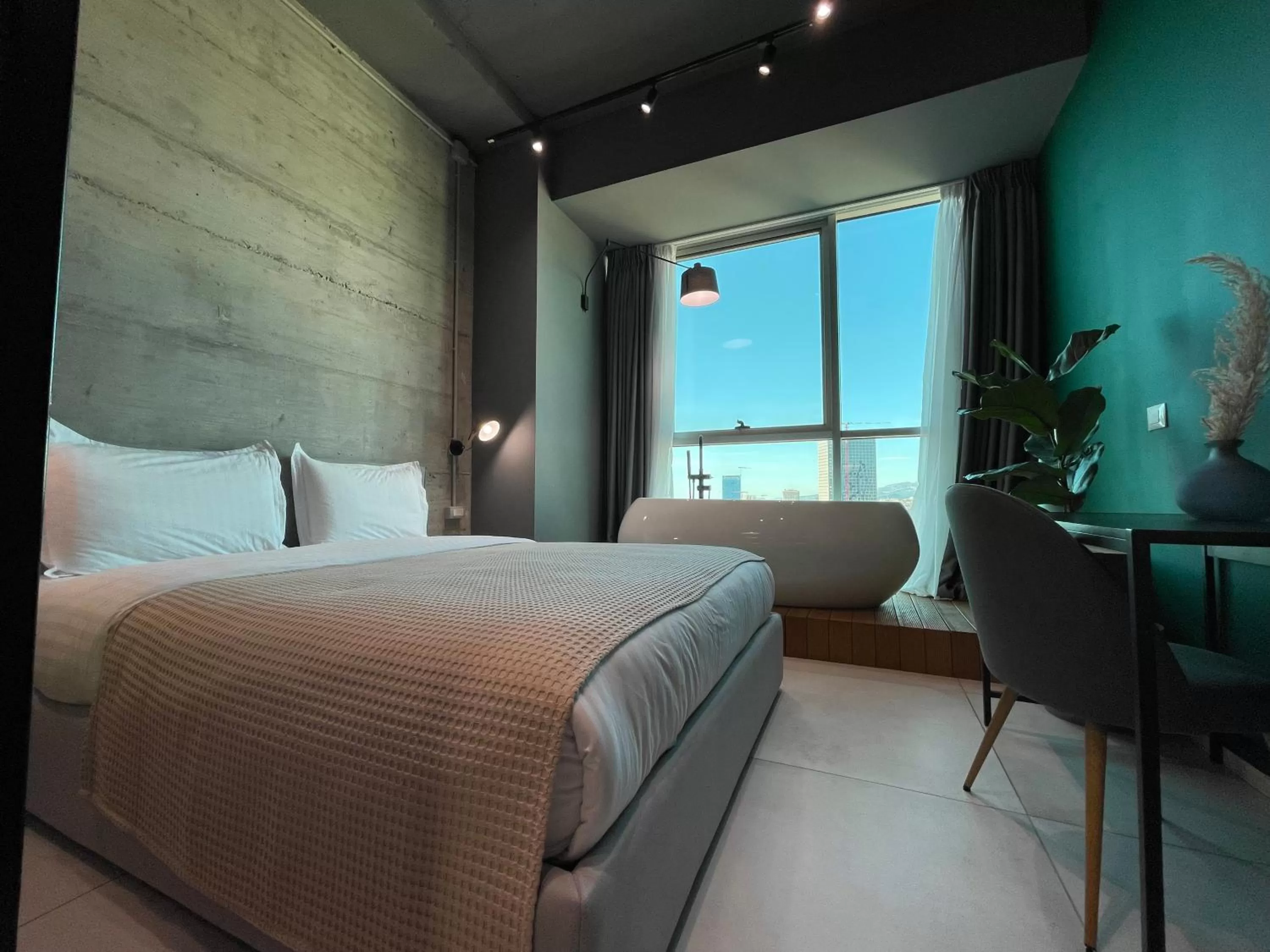 Bed in Ambassador Skyline Apartments