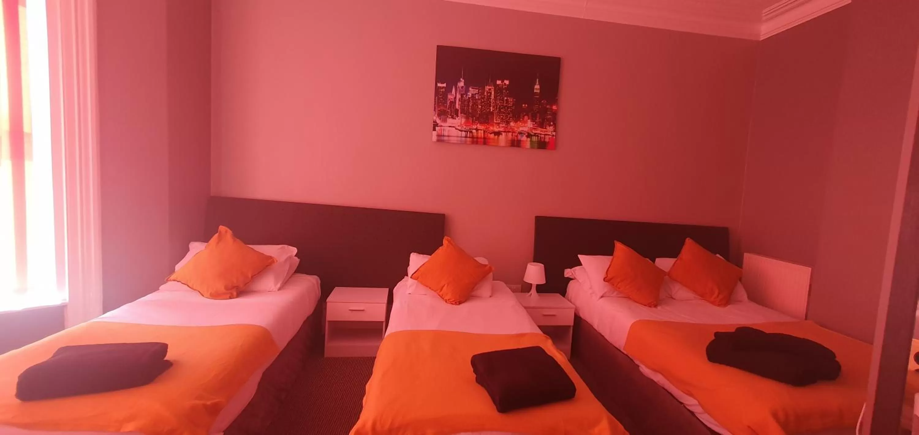 Bed in Palm Beach Hotel by the Sea