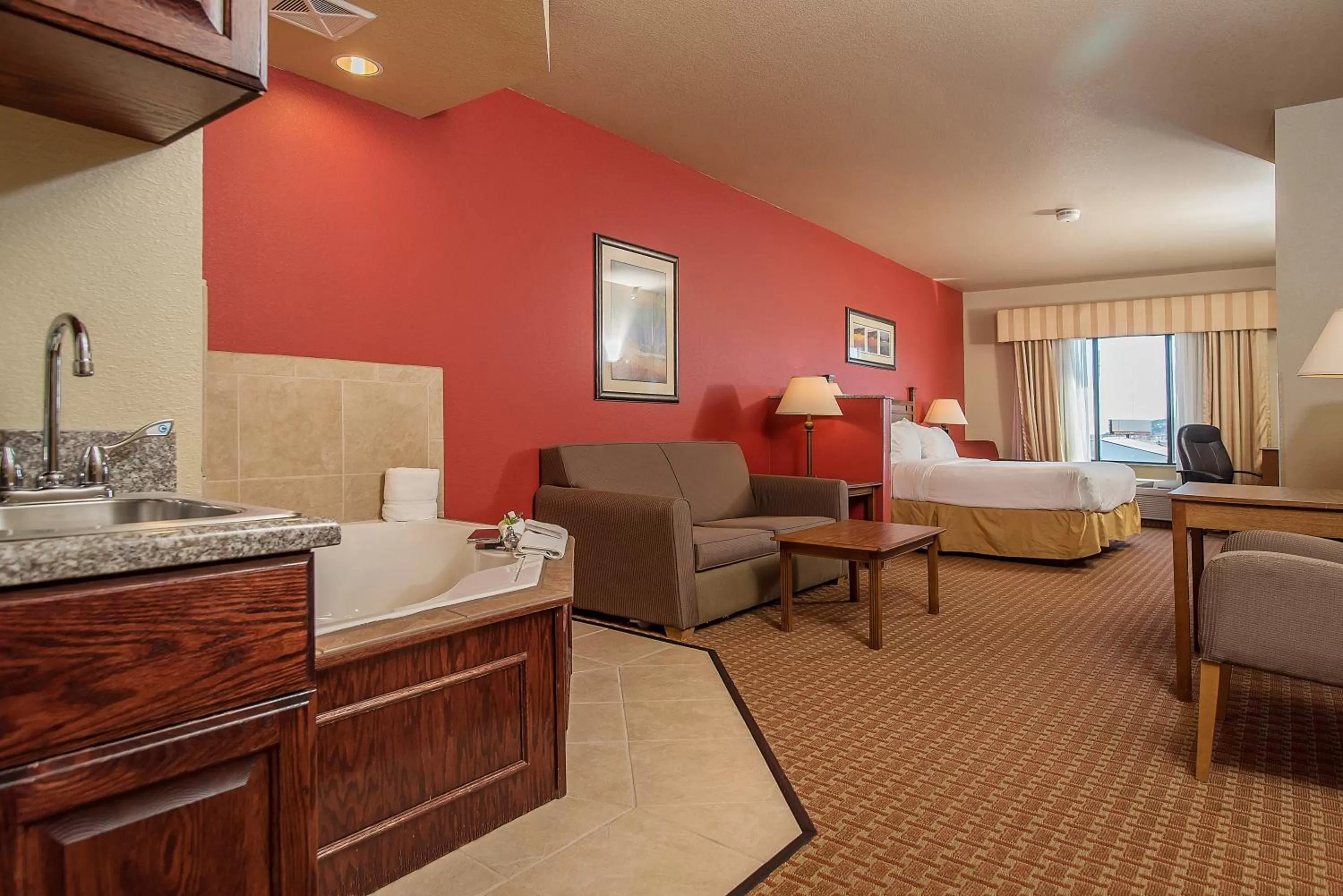 Bed in Baymont Inn & Suites by Wyndham Sturgis