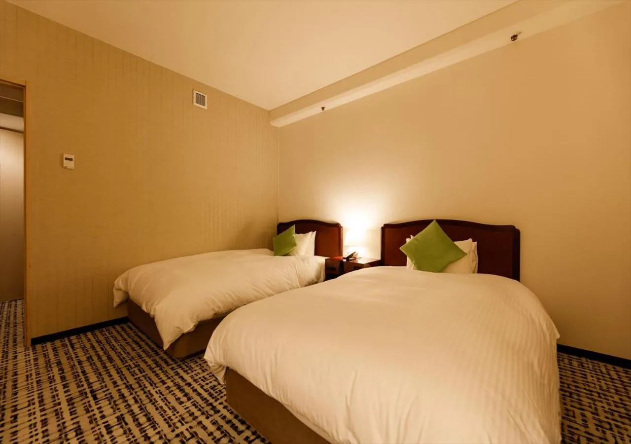 Bed in Kanazawa New Grand Hotel Prestige