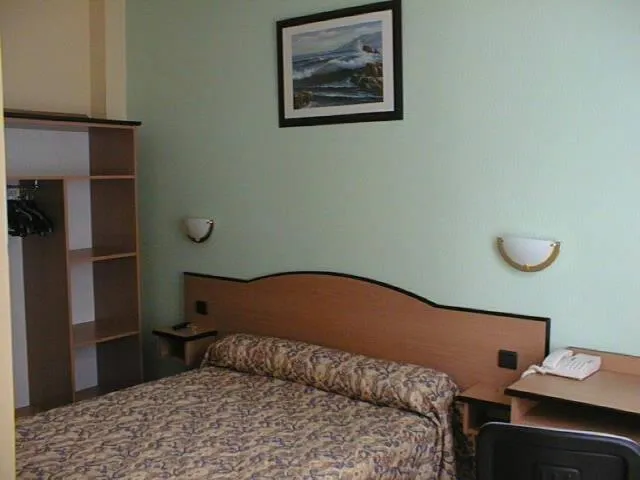 Bed in Hotel Ferney République