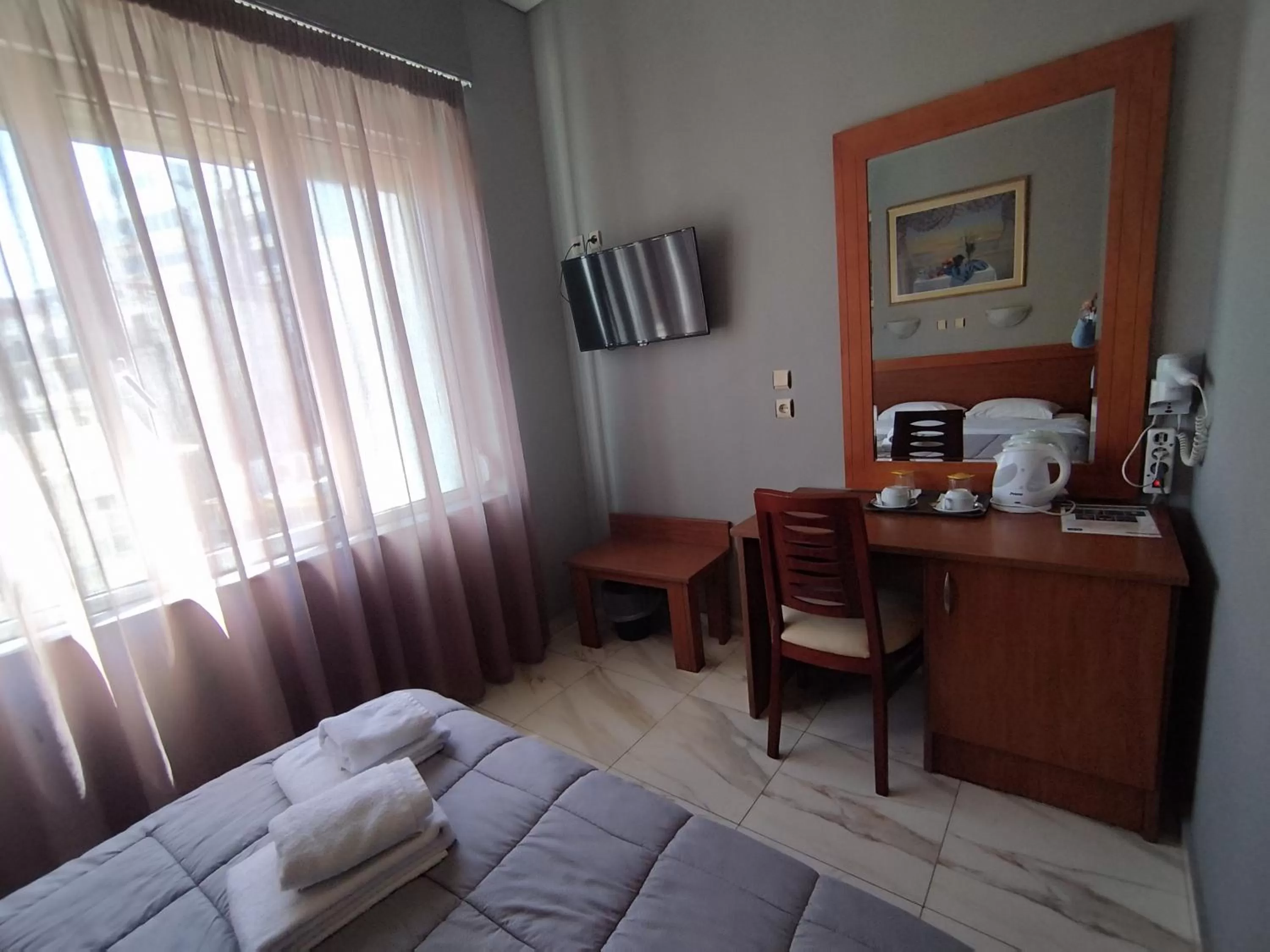 Bed in Piraeus Acropole Hotel