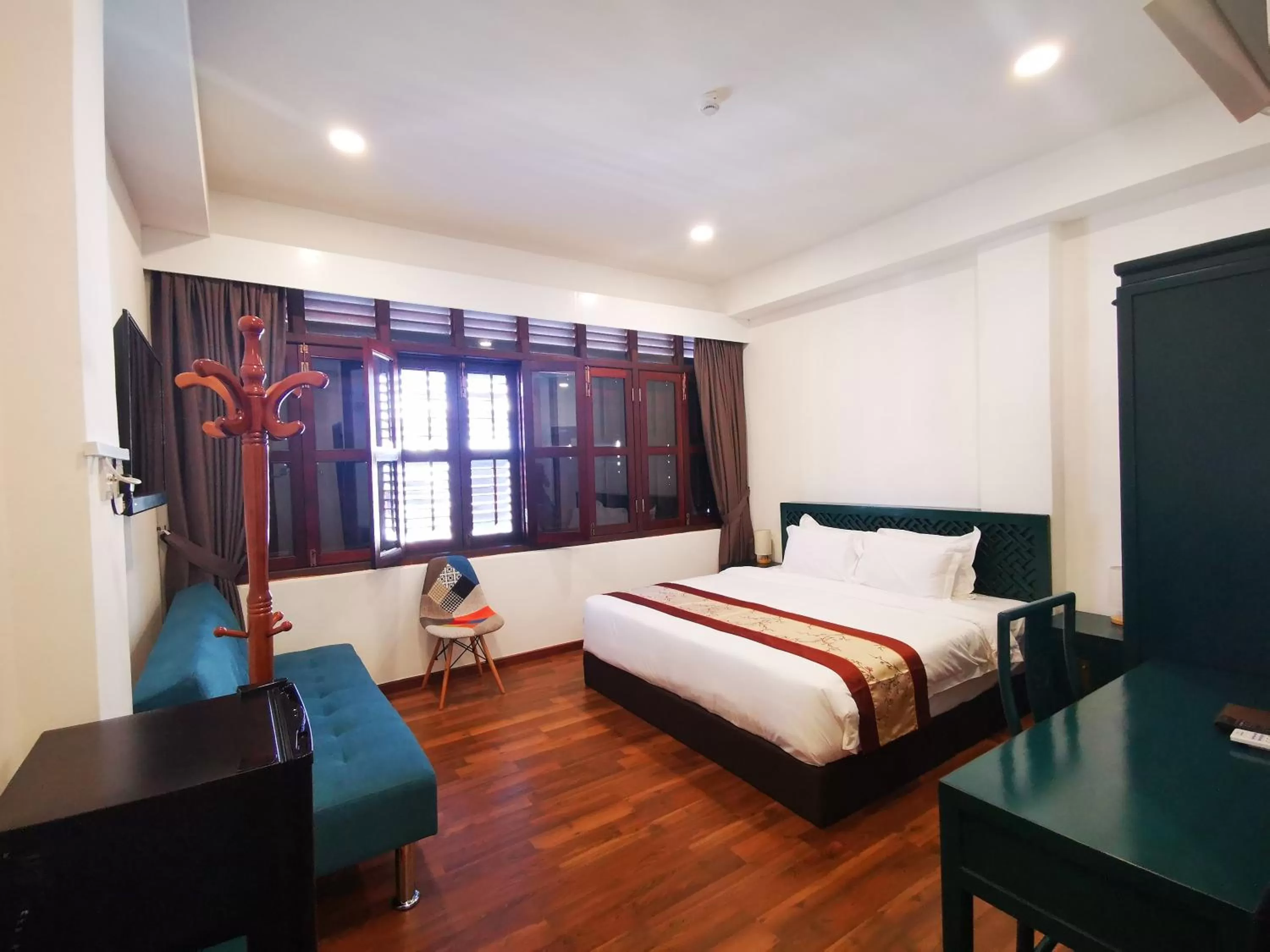 Bed in Mclane Boutique Hotel