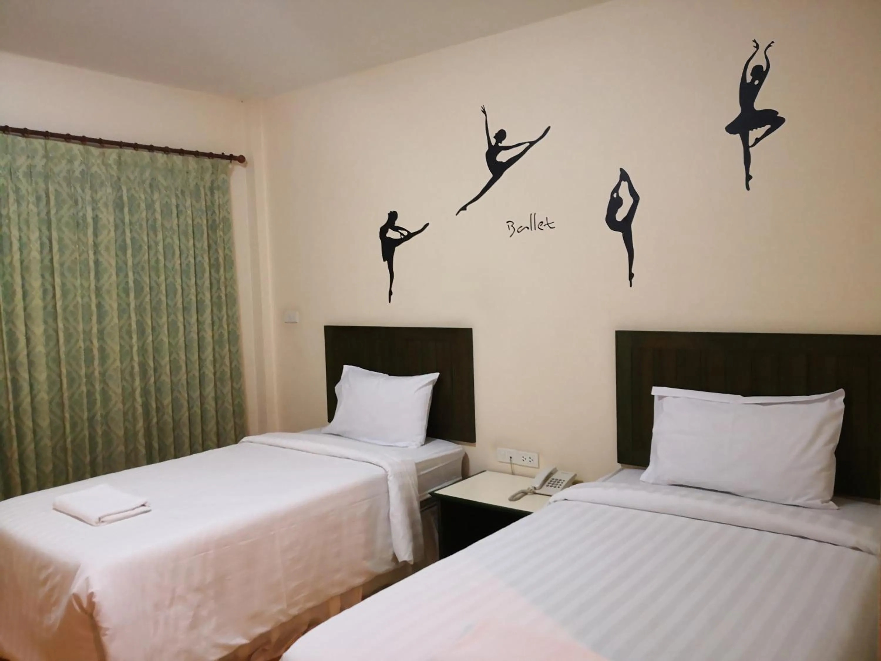 Bed in Baan Suksiri Hotel