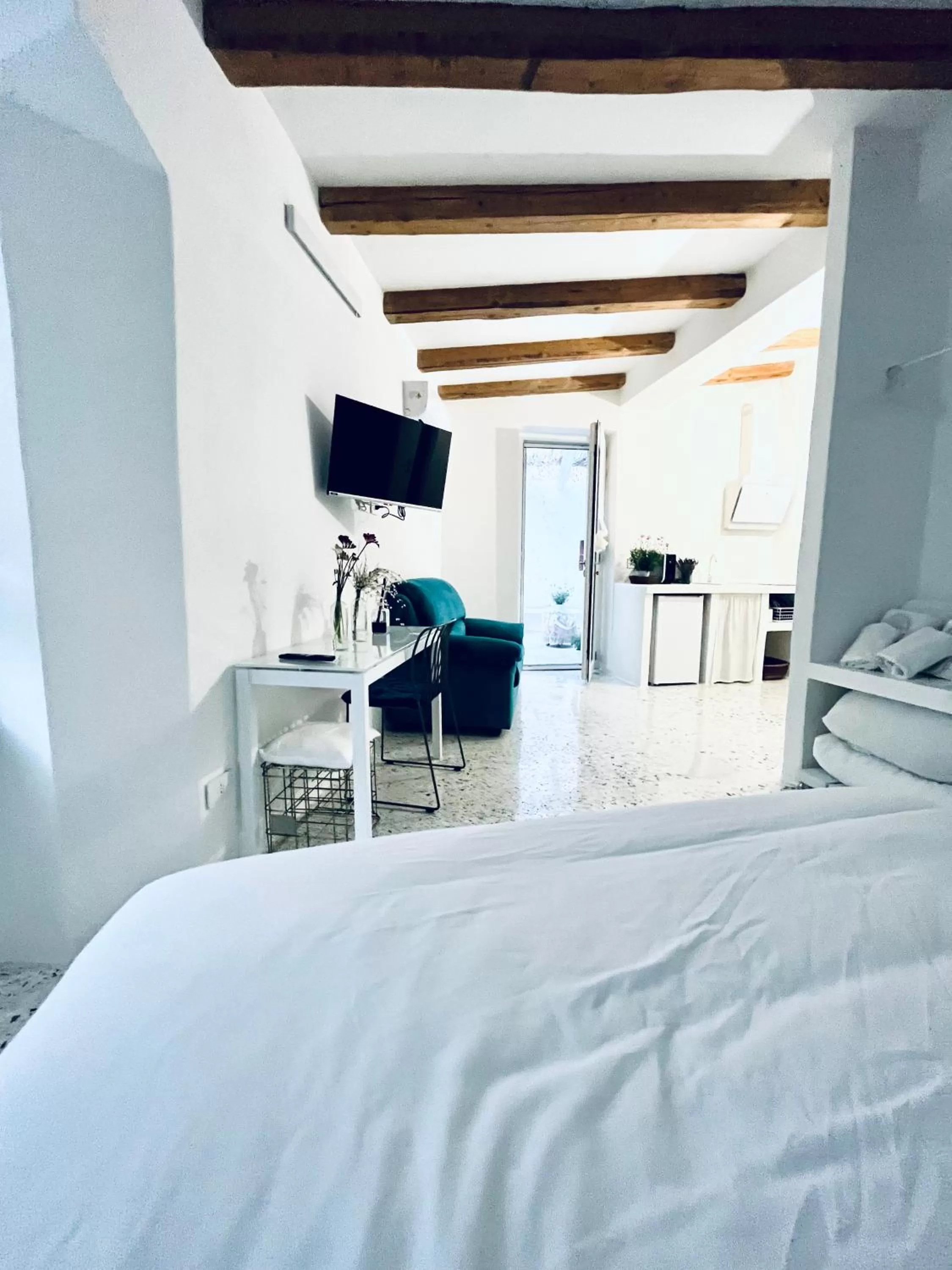 Bed in Hydria guest house art gallery