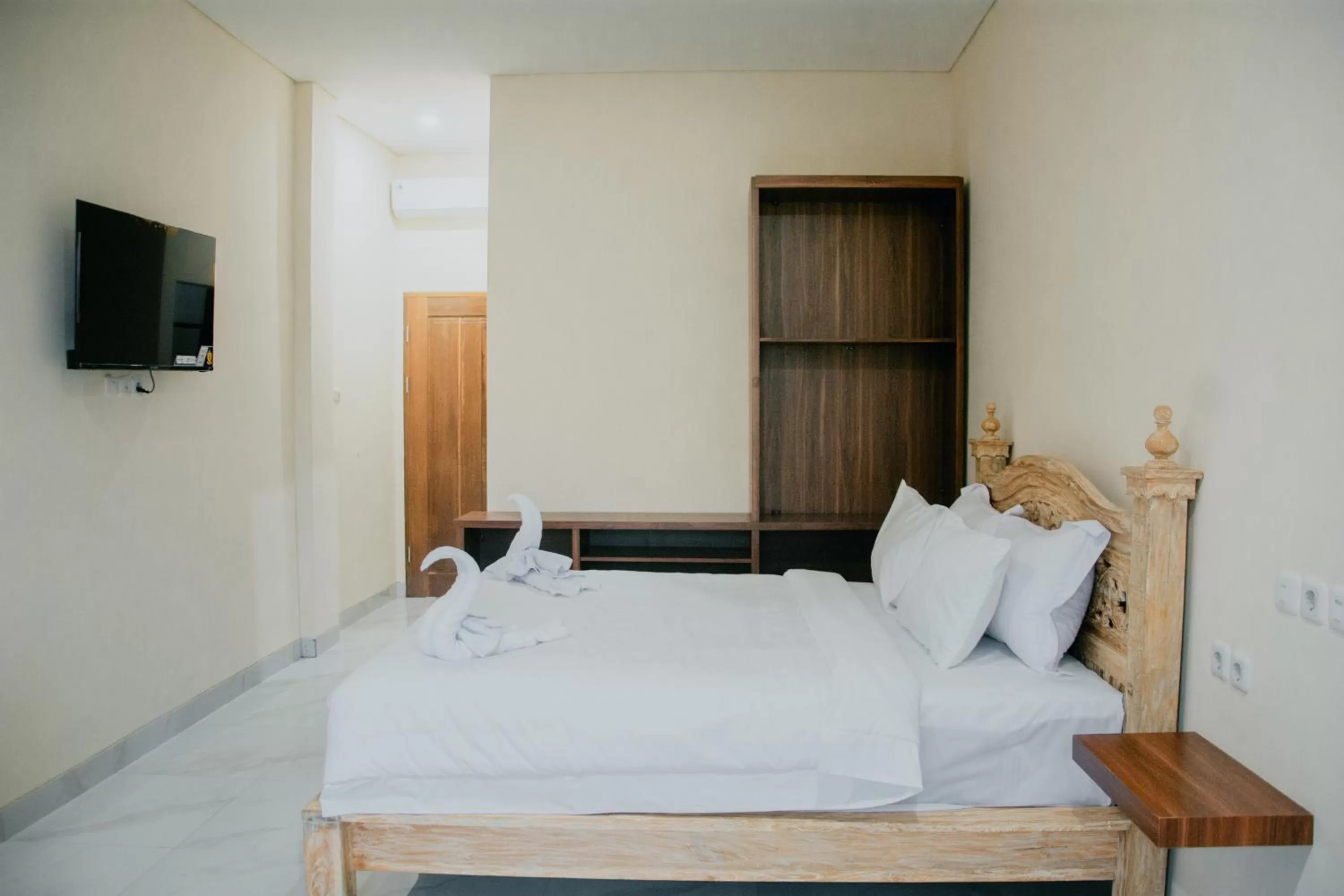 Bed in THE LAVIANA HOTEL