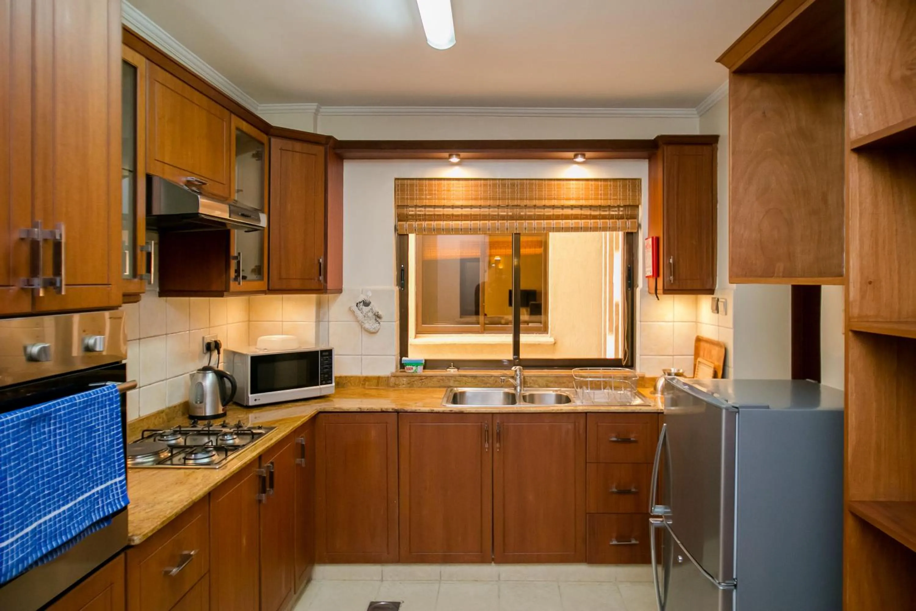 Kitchen or kitchenette in Waridi Paradise Hotel and Suites