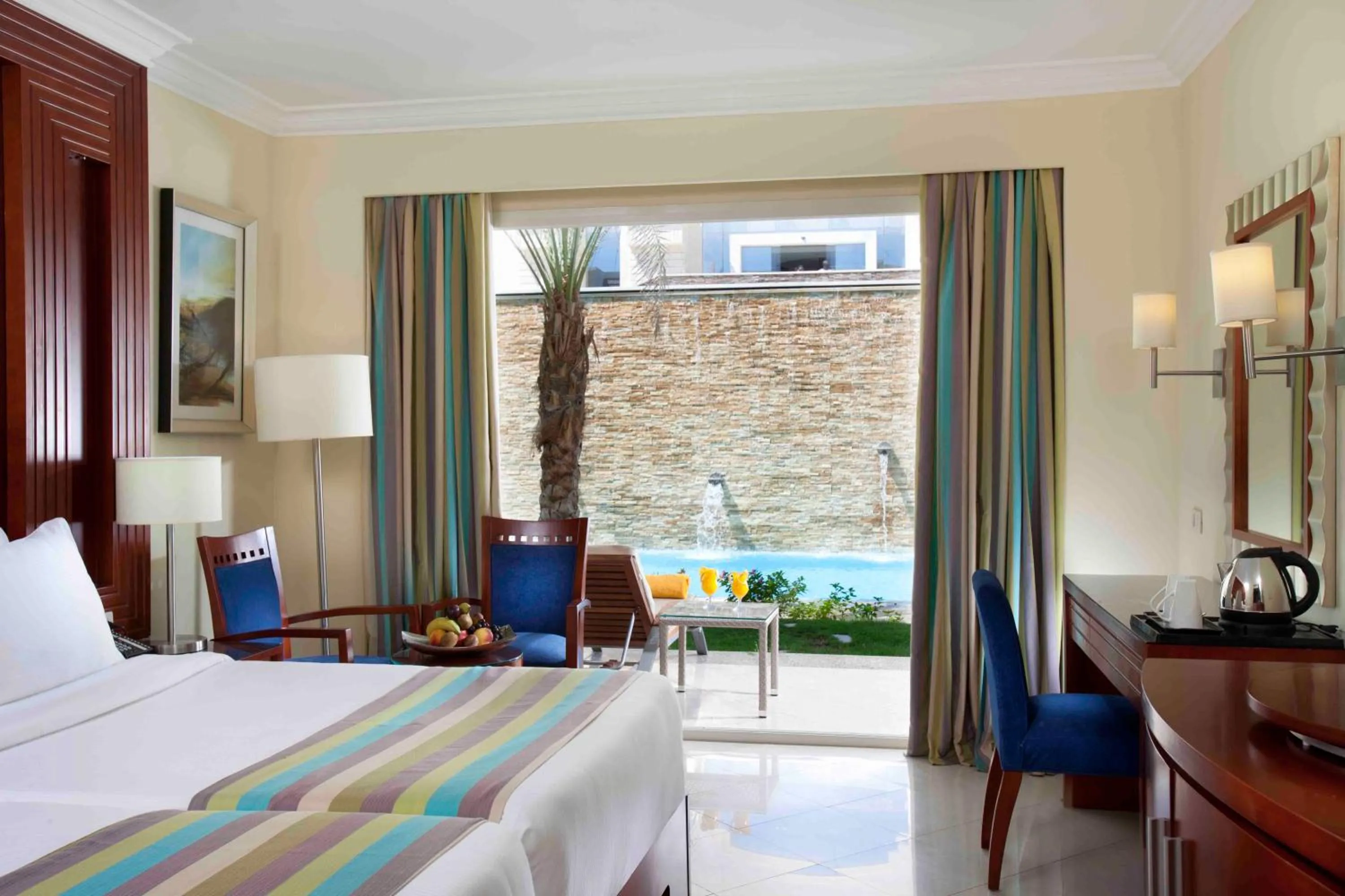 Bed in Xperience Sea Breeze Resort