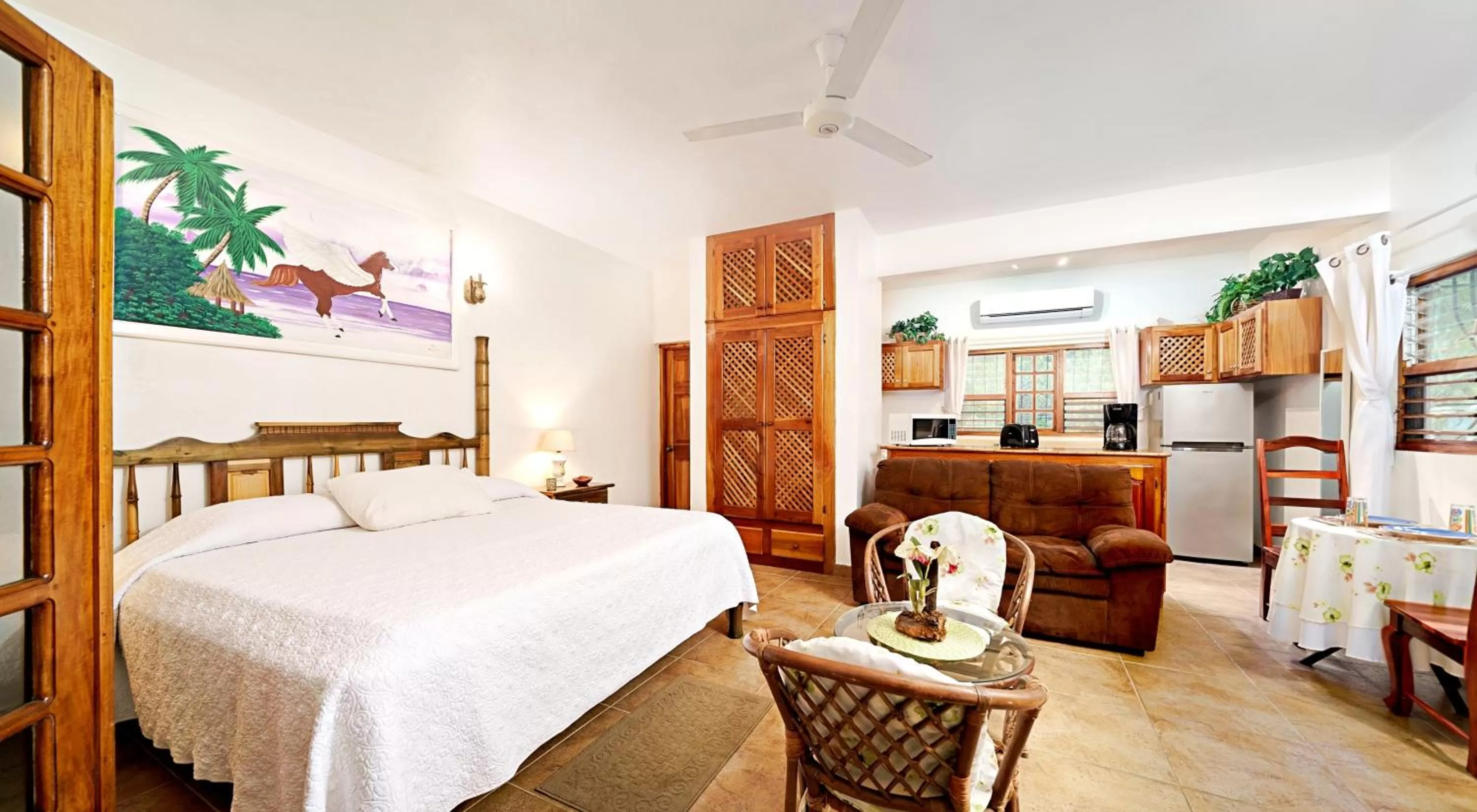 Living room, Bed in Beach House Condos, Negril