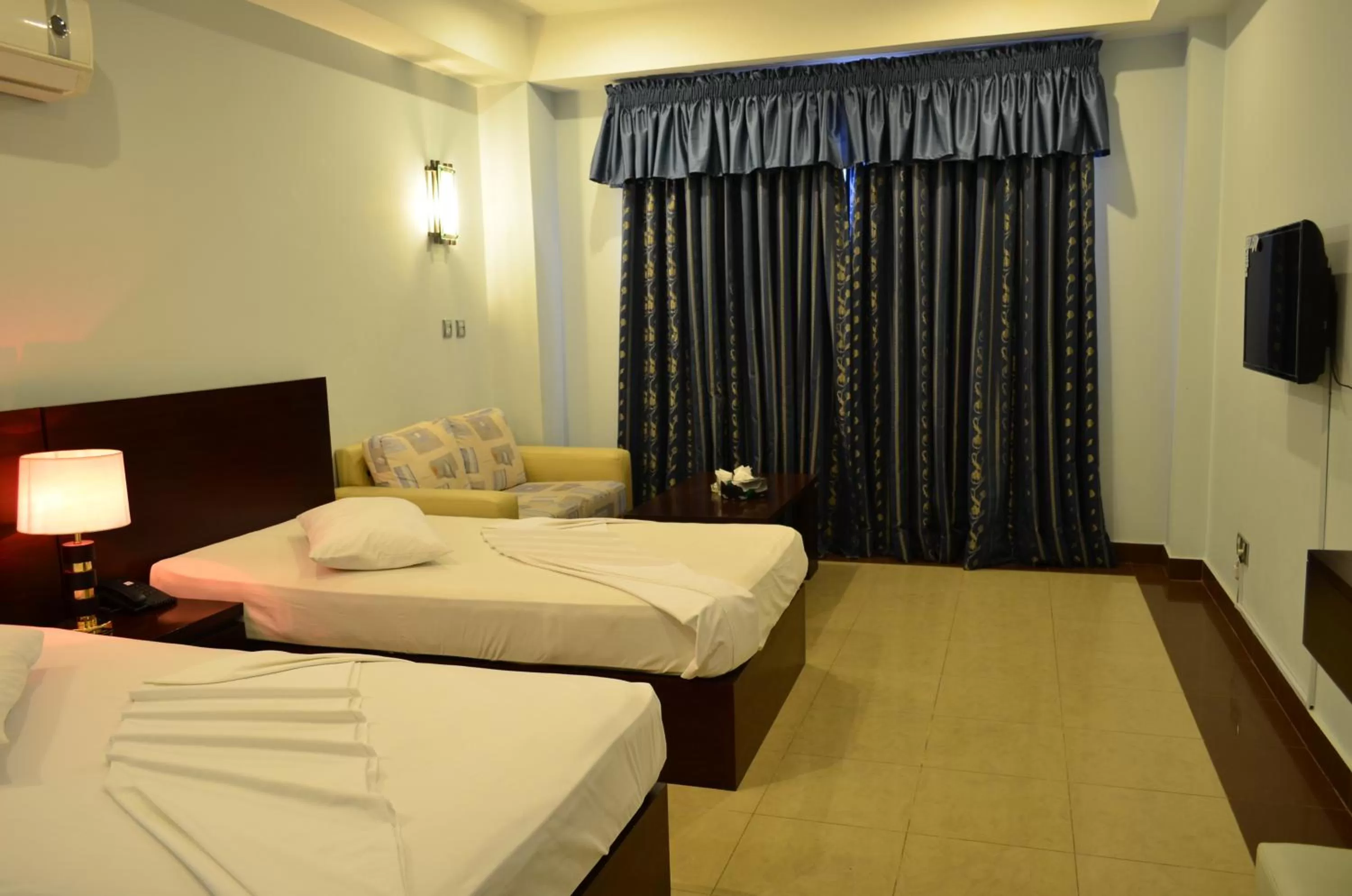 Bed in Hotel Multan Continental