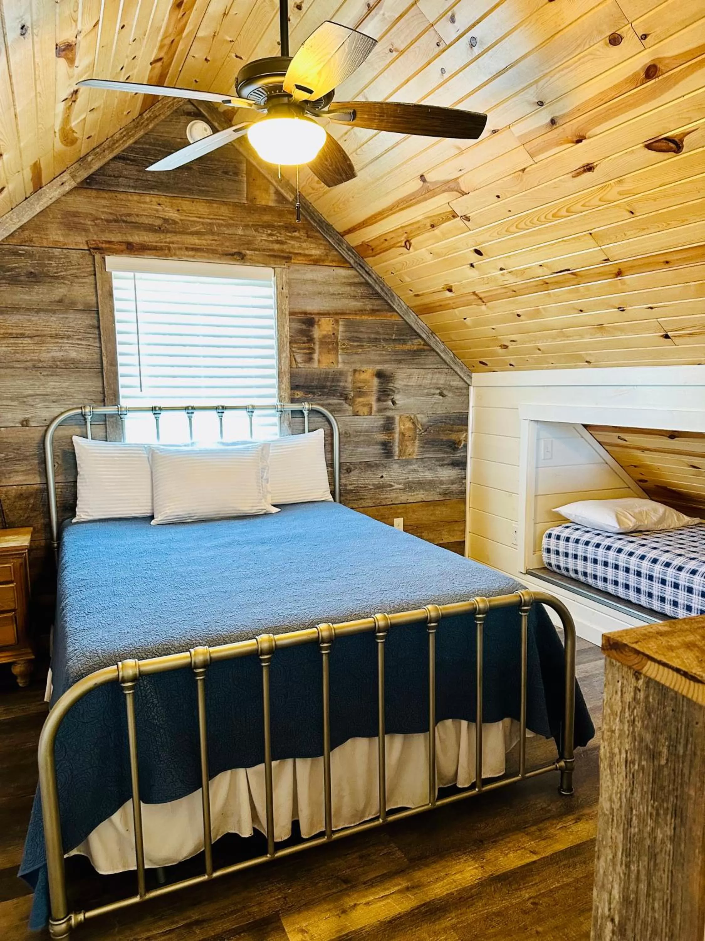 Bed in Knotty Squirrel Cabins