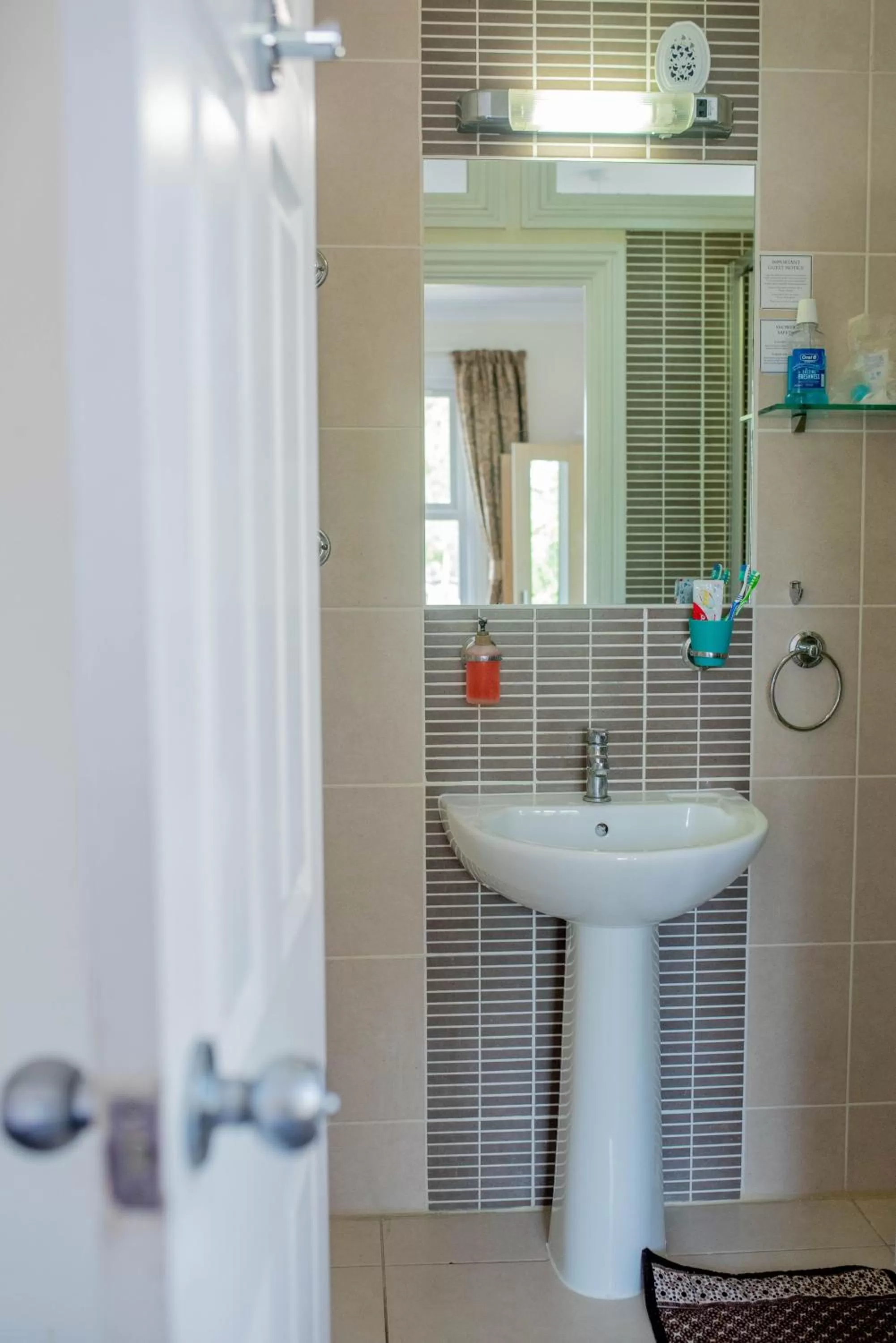 Toilet in Revado Hotel