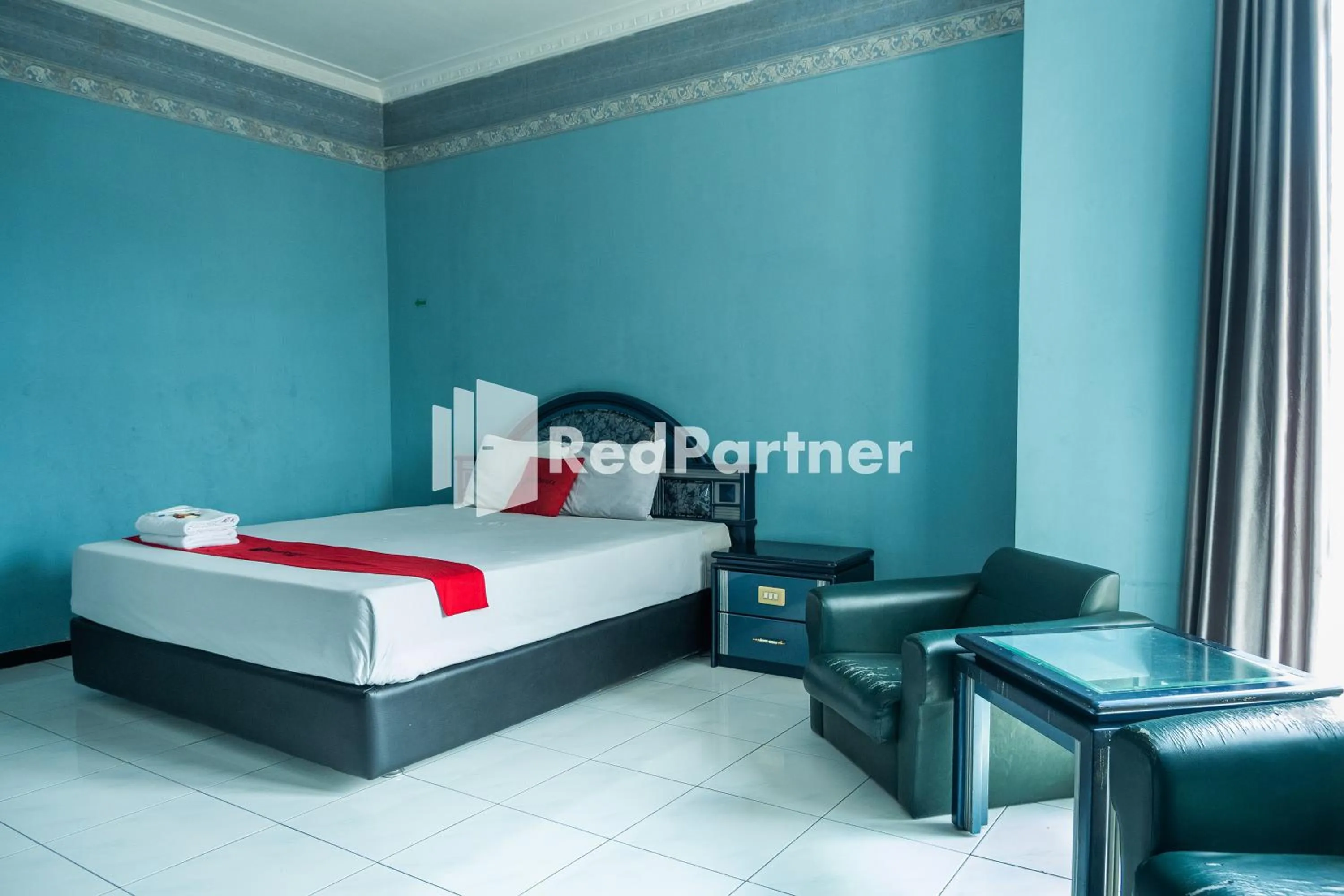 Bed in Akur Hotel Malioboro Mitra RedDoorz