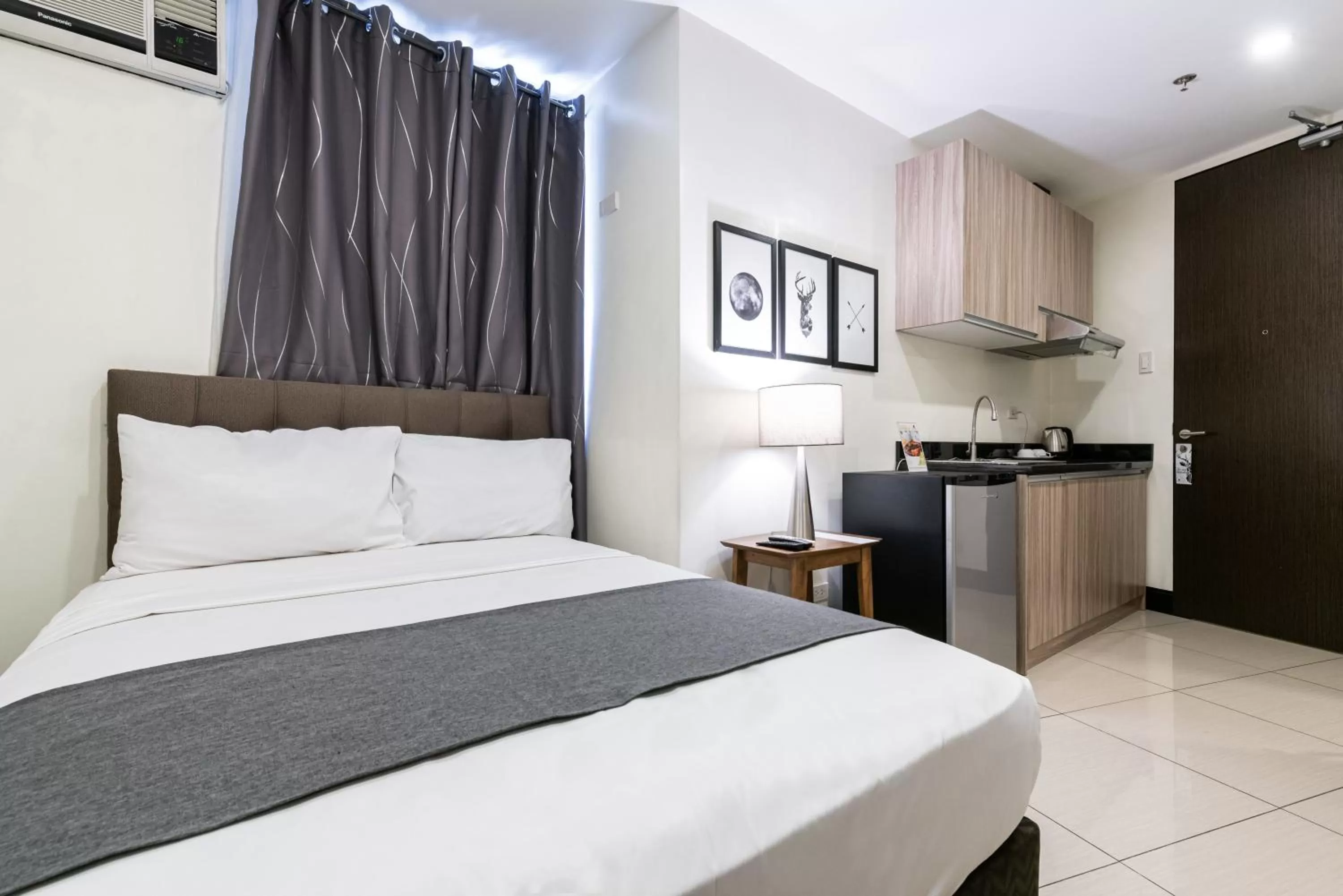 Bedroom, Bed in Artemis Place Makati Hotel