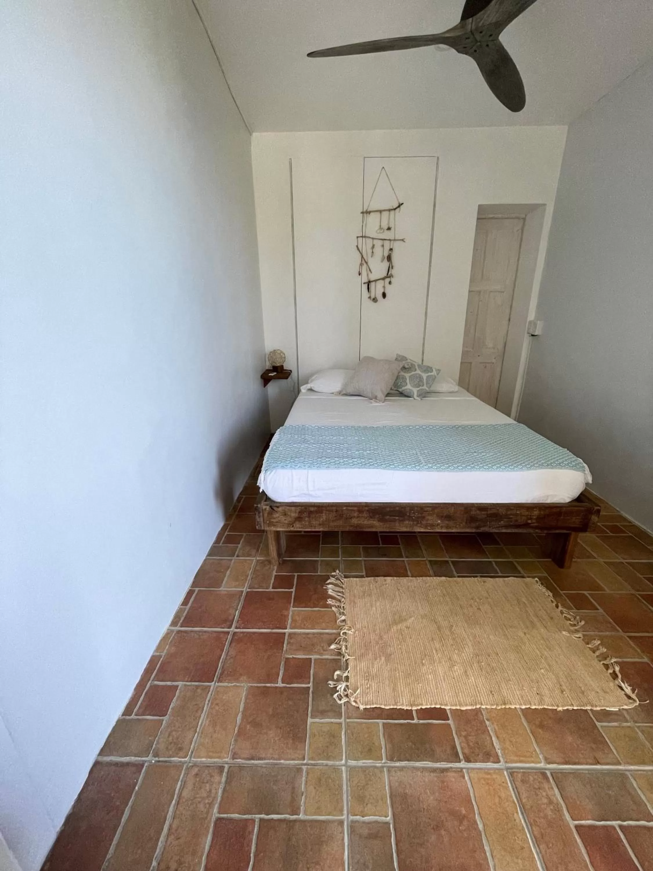 Photo of the whole room, Bed in Bird Island Bungalows