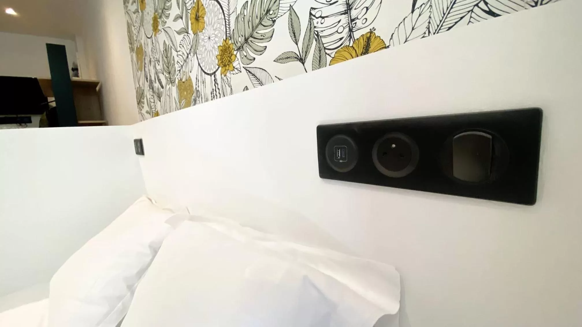 Bed in Le Bras d'or Apparts et Spa