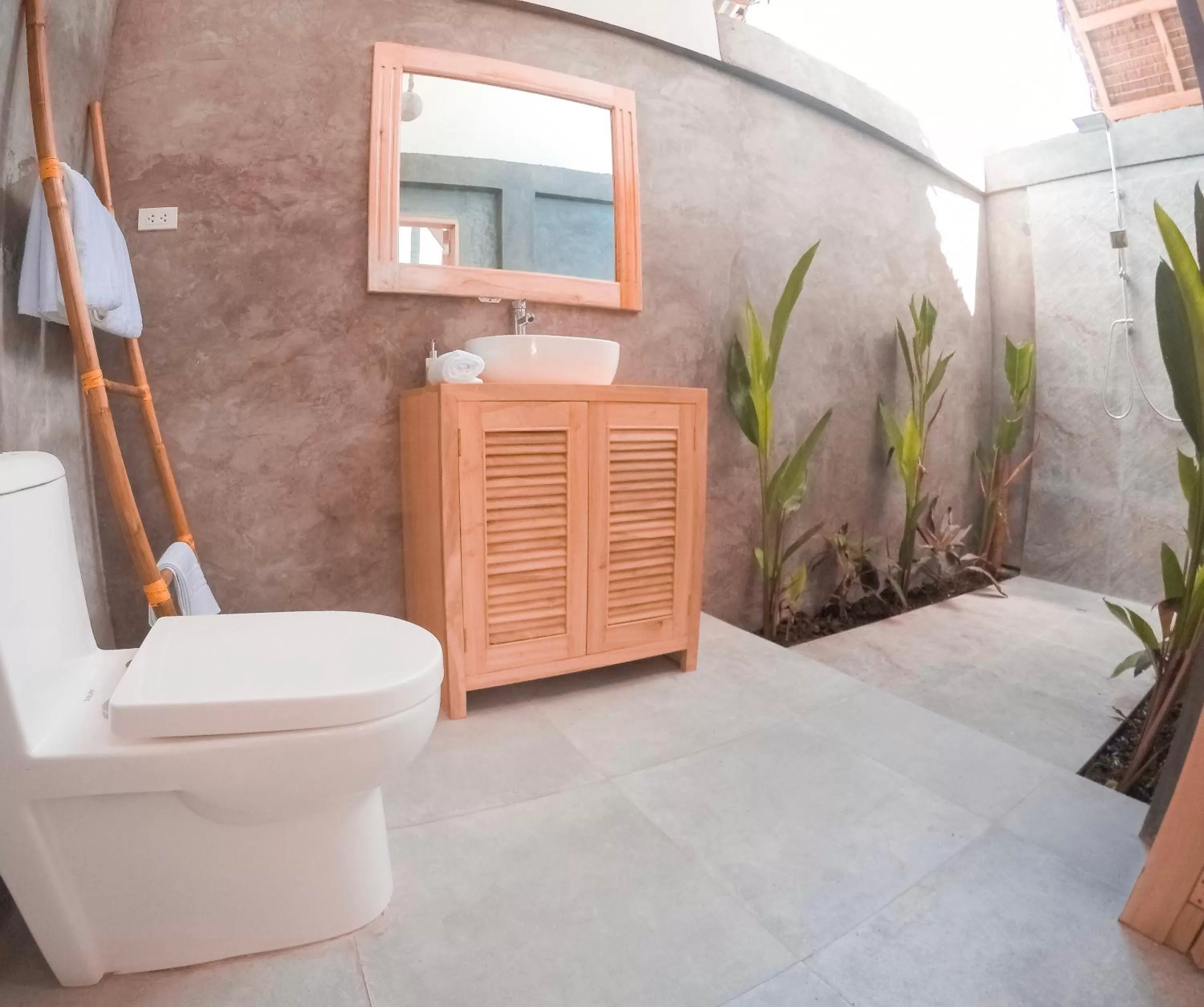 Toilet in Bermuda Triangle Bungalows