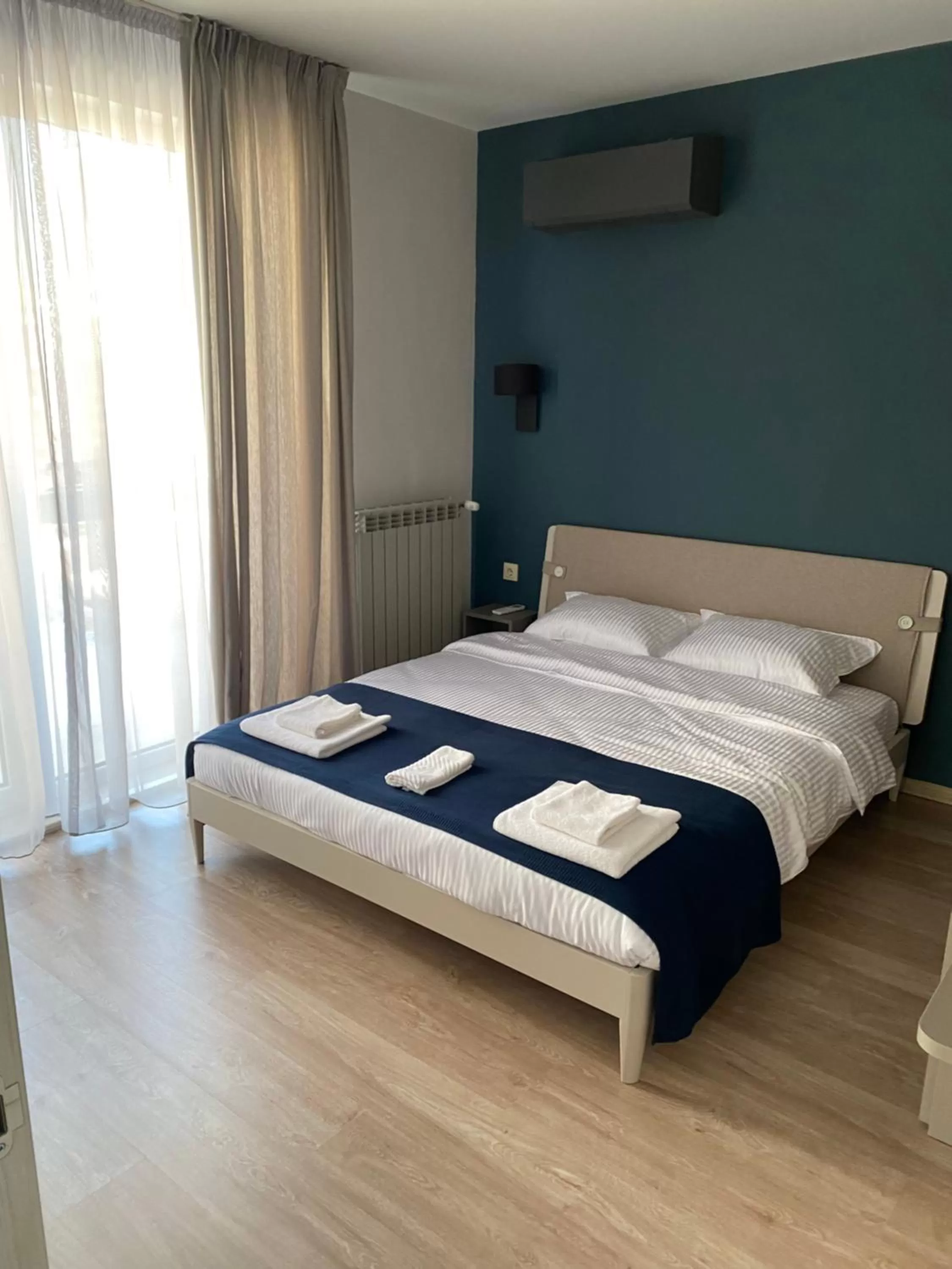 Bed in 7th Sense boutique apartments