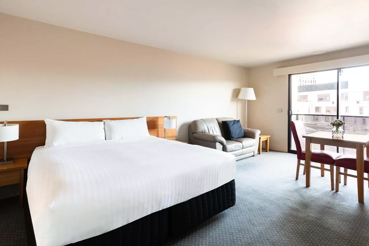 Seating area, Bed in The Old Woolstore Apartment Hotel