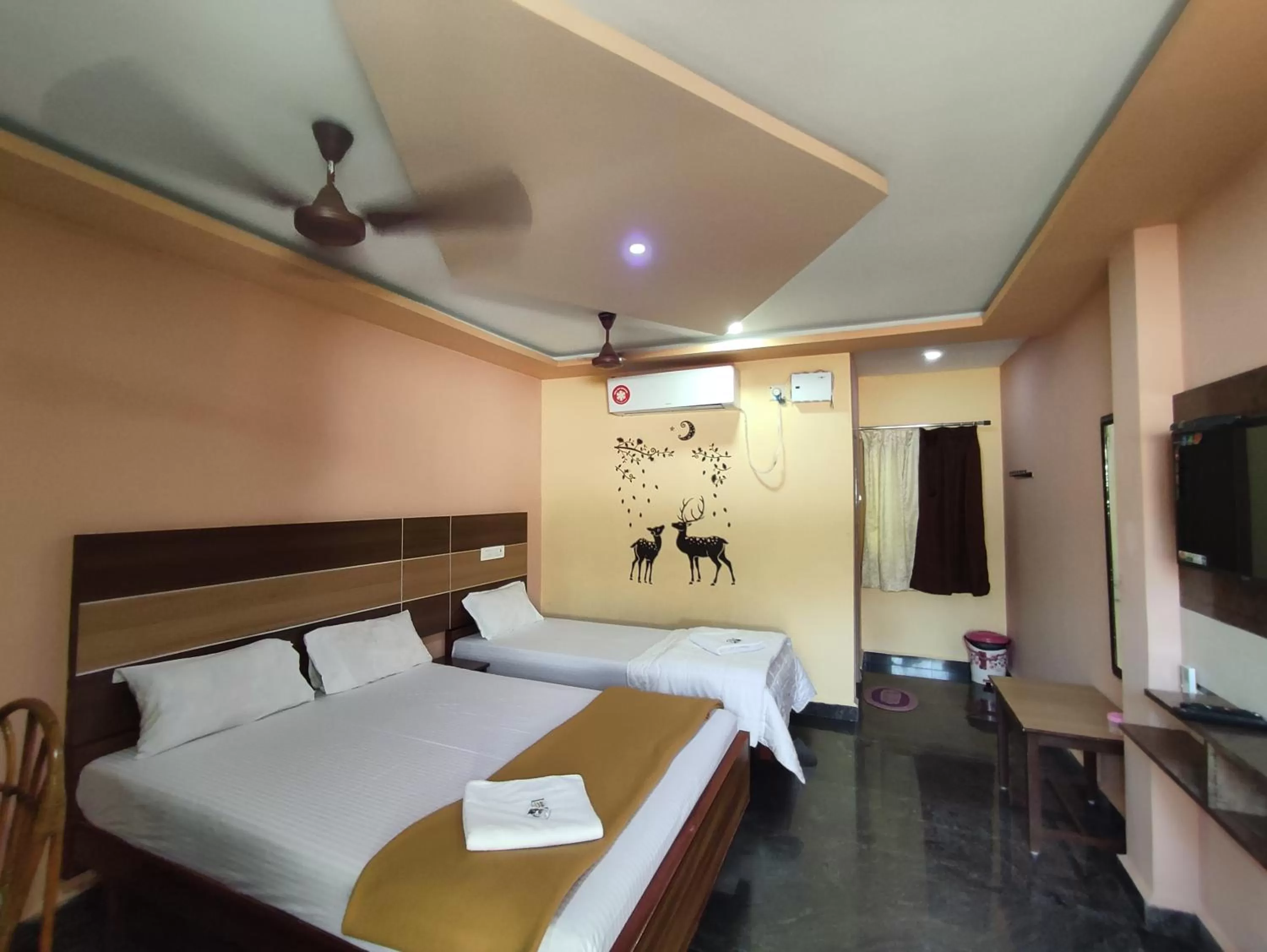 air conditioner, Bed in Sri Murugan Beach Paradise Hotel
