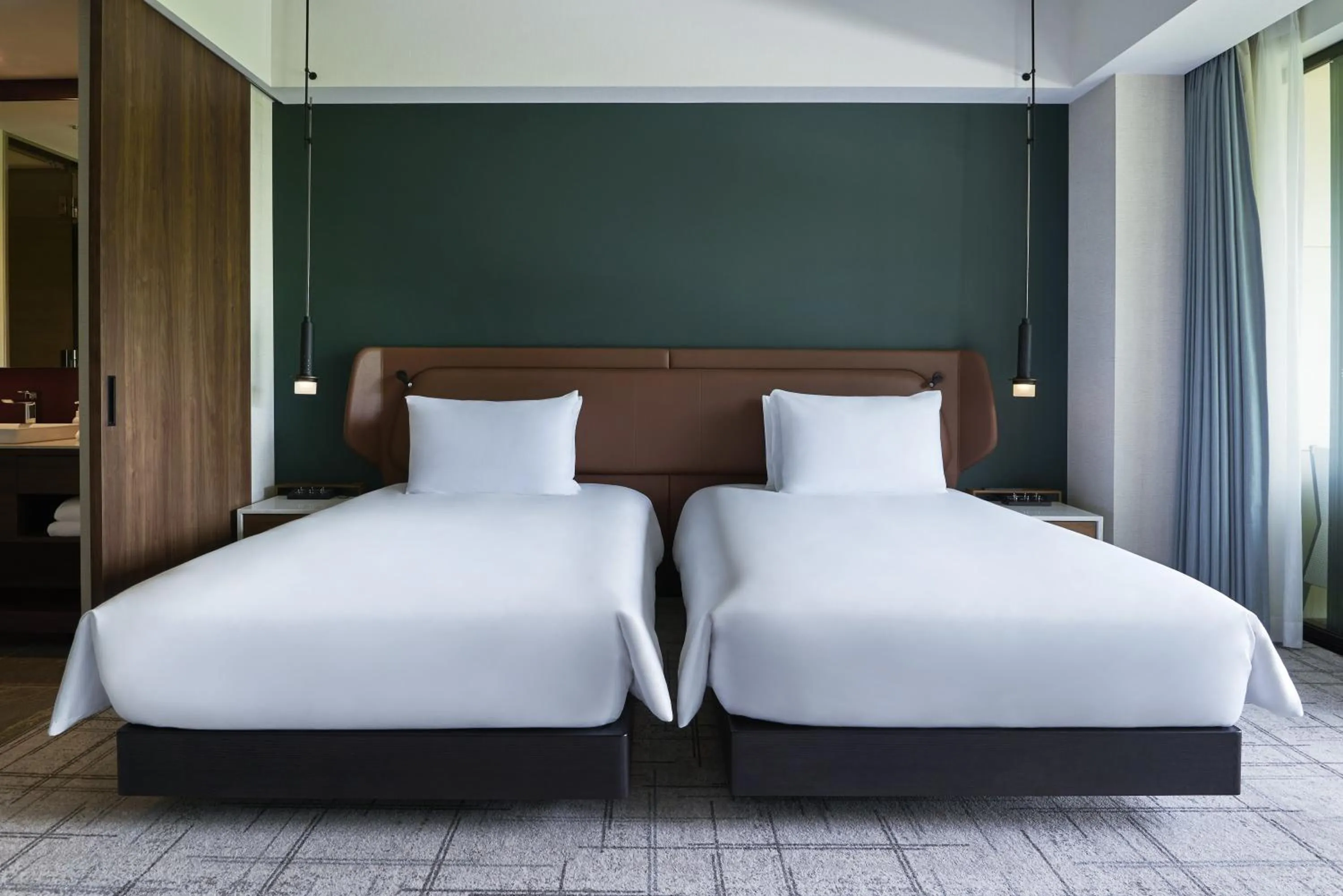 Bed in Fuji Speedway Hotel, in The Unbound Collection by Hyatt