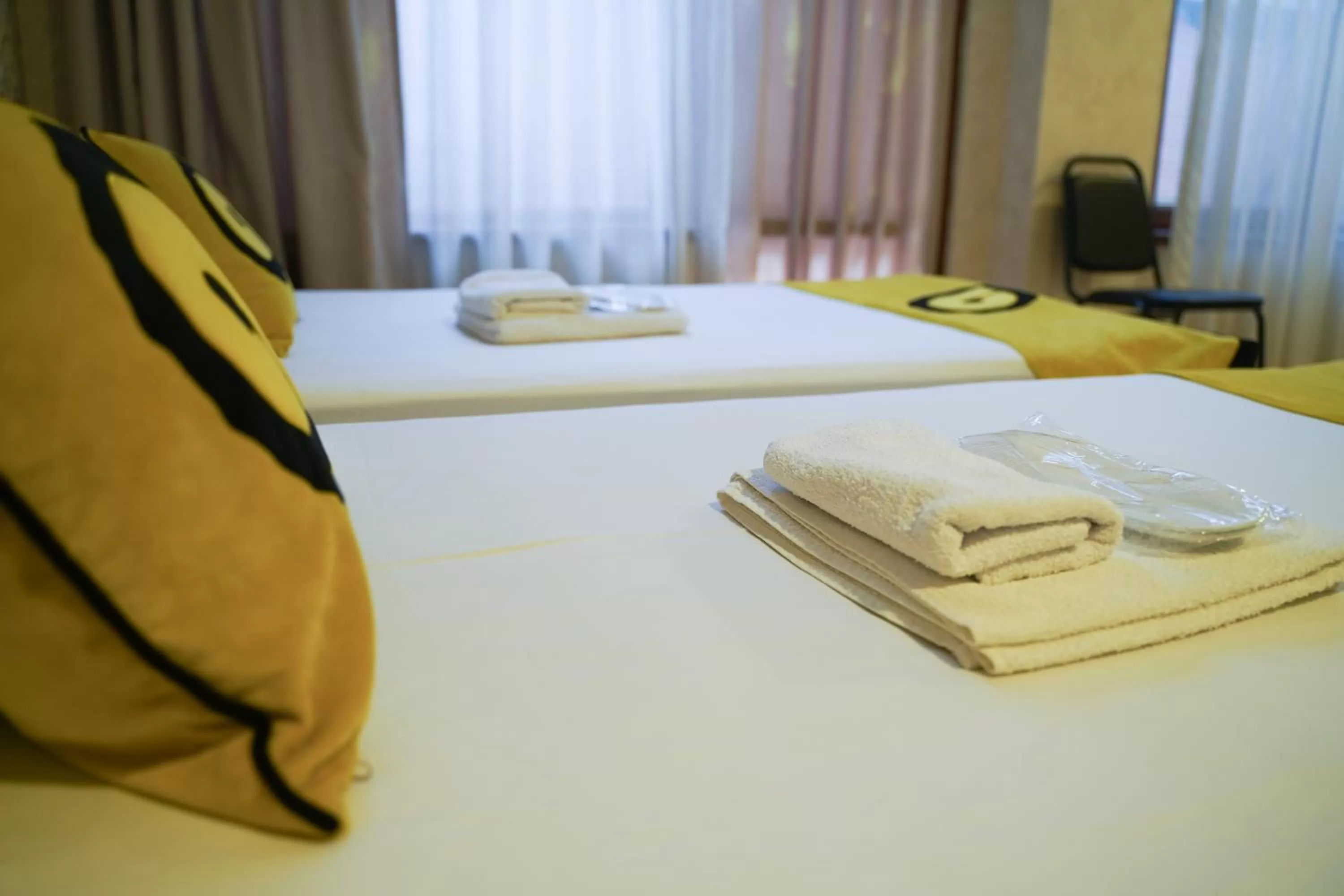 towels, Bed in Aura Plaza Hotel