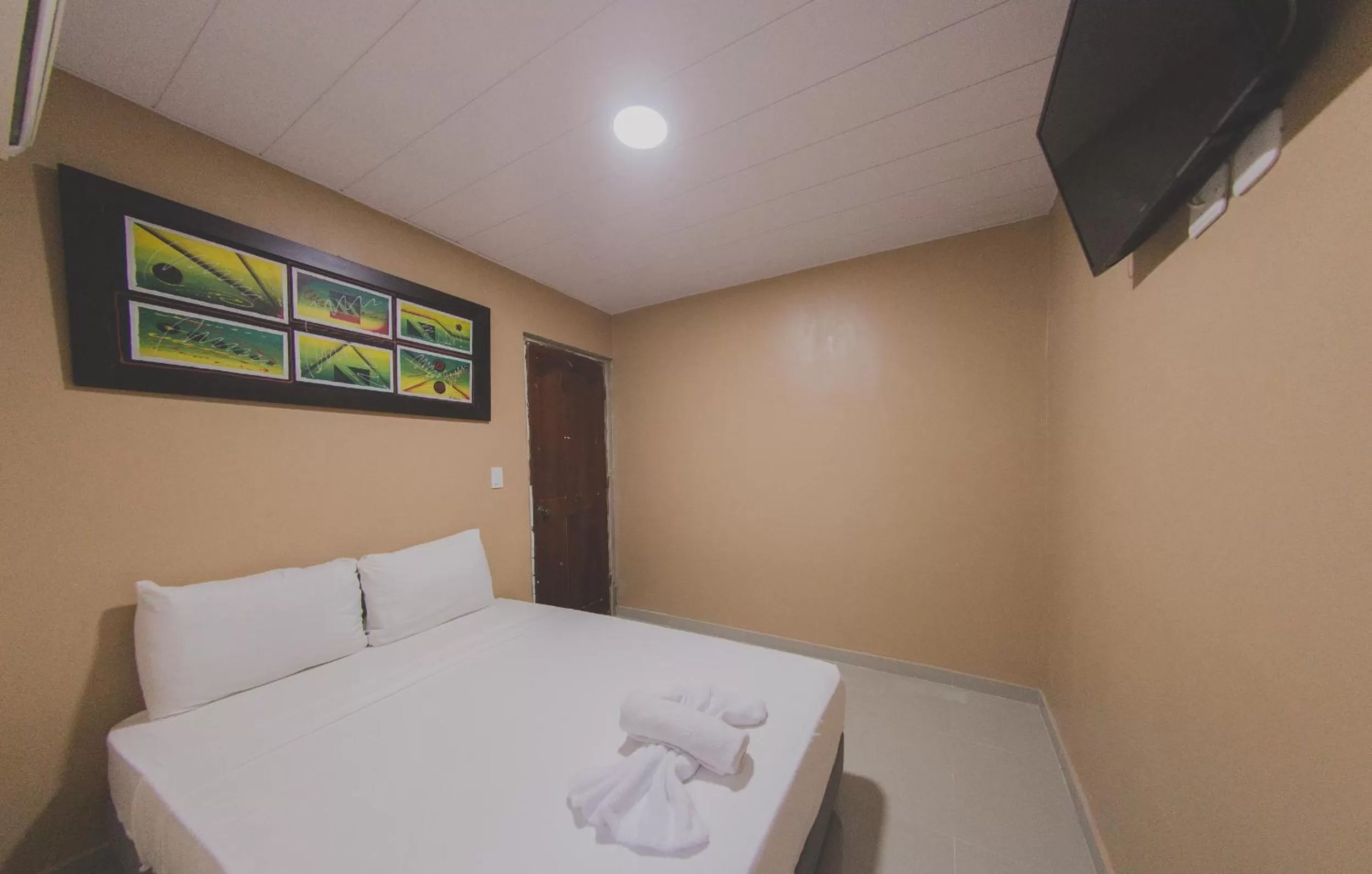 Bed in Hotel Boquilla Suites By GEH Suites