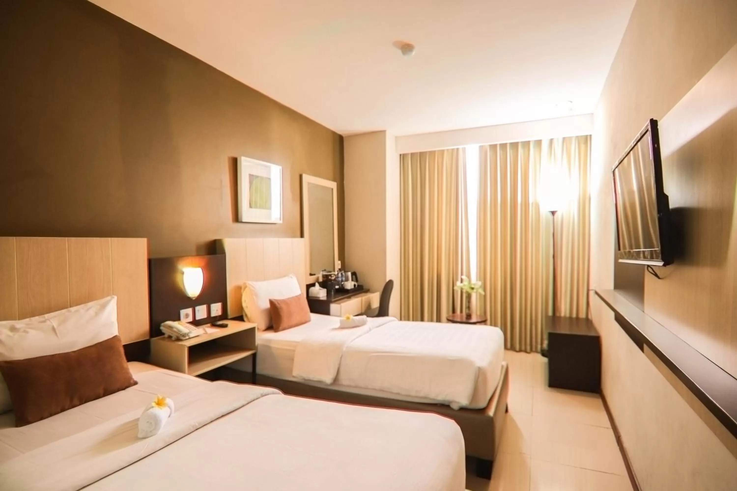 Bed in De Laxston Hotel Yogyakarta, Azana Hotels Collection