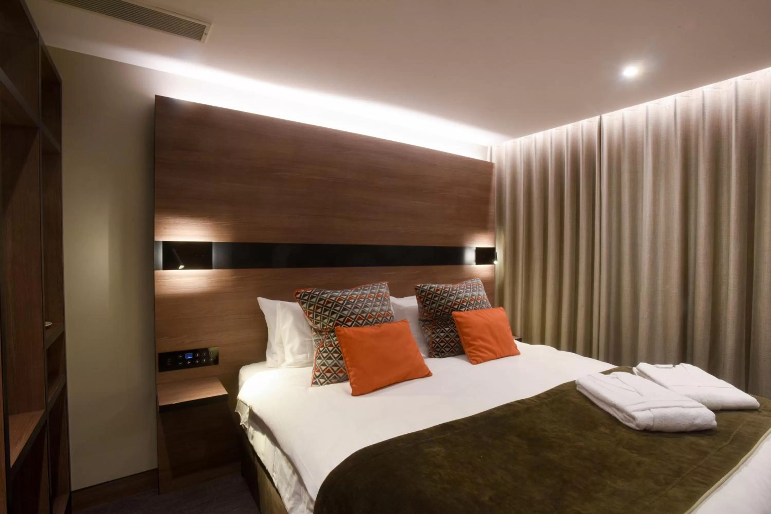 Bed in Merit Kensington Hotel