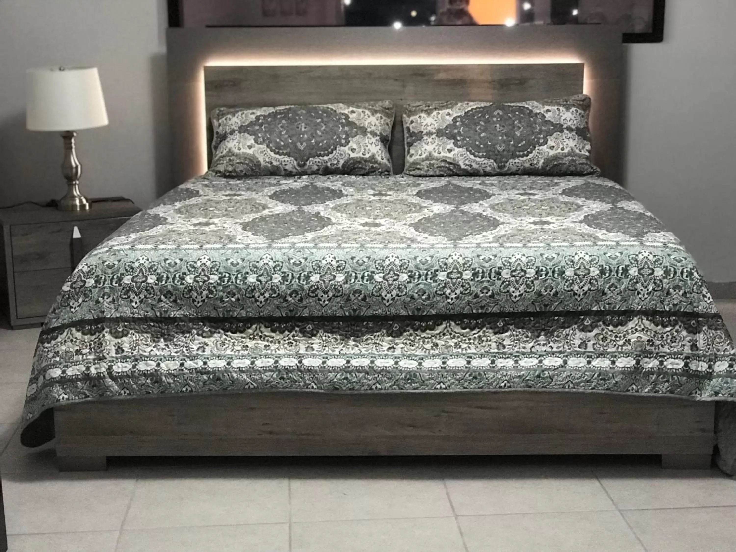 Bed in Itza-Bella Suites