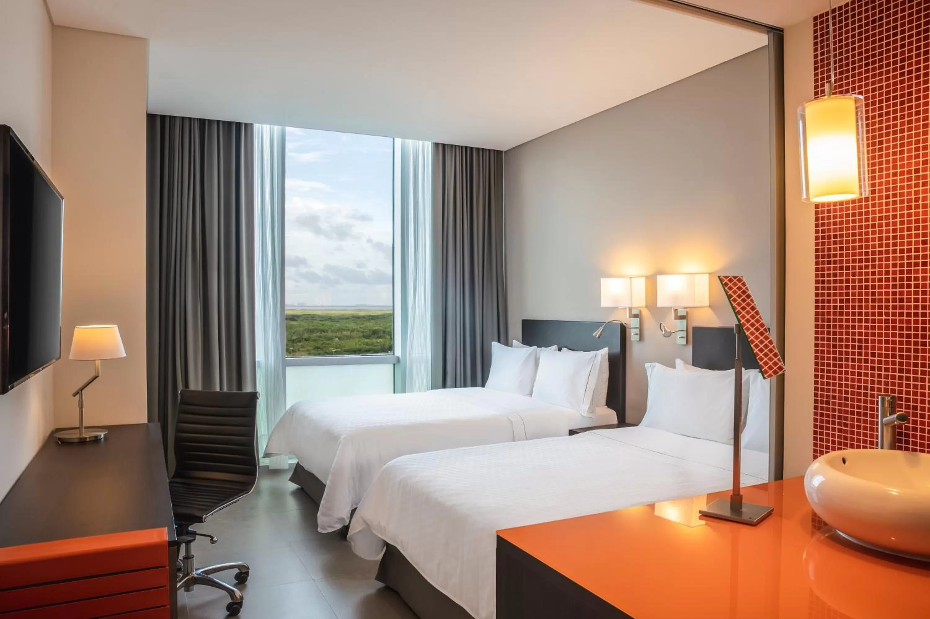 Photo of the whole room, Bed in Fiesta Inn Cancun Las Americas